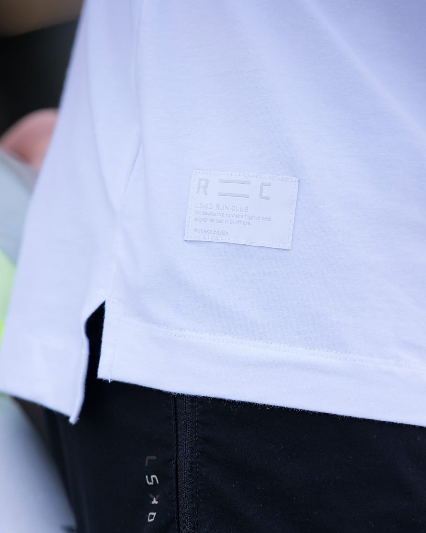 Model wearing Run Club FLXDRY Performance Tee - White-Reflective