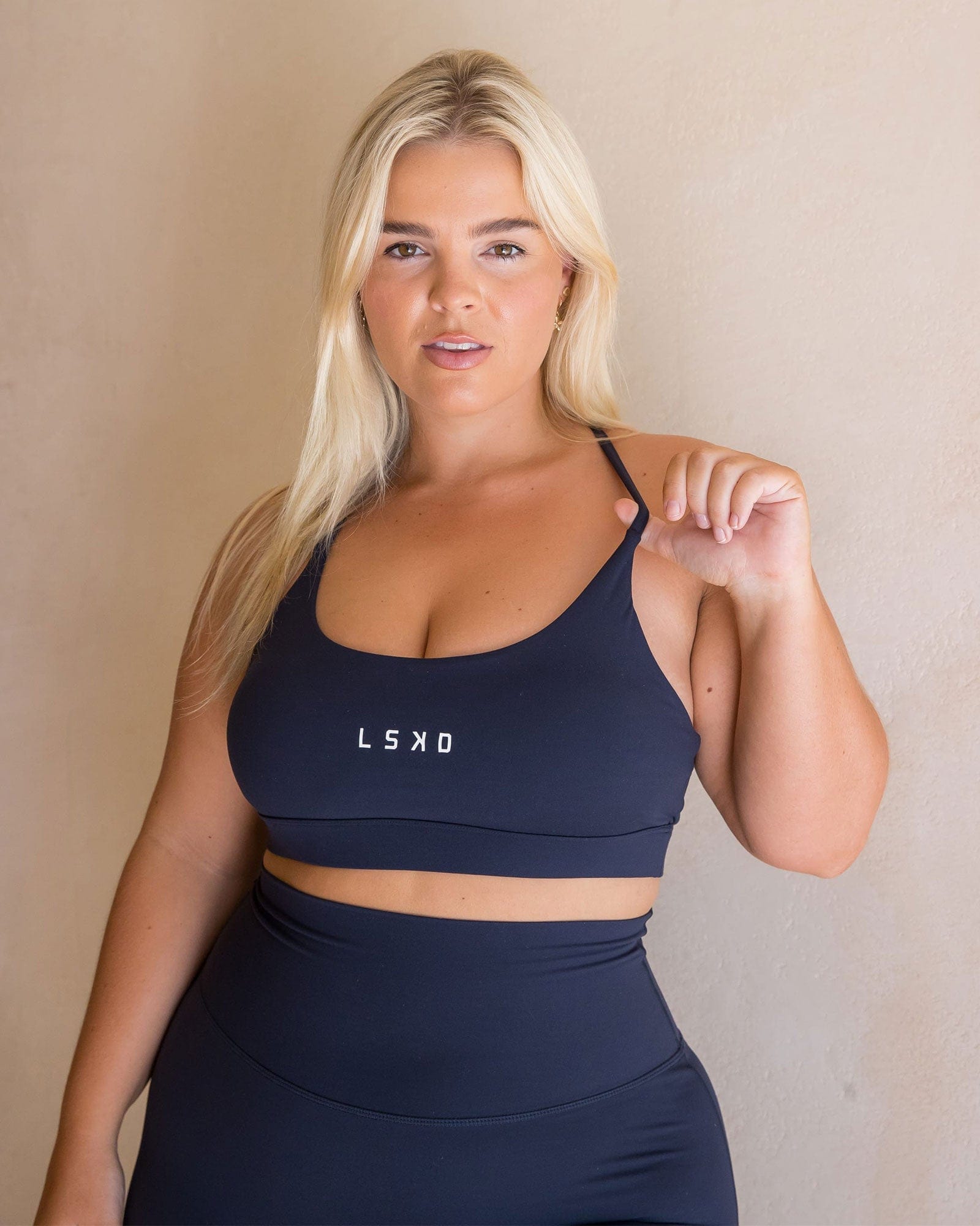 Model wearing Elixir Sports Bra - Navy