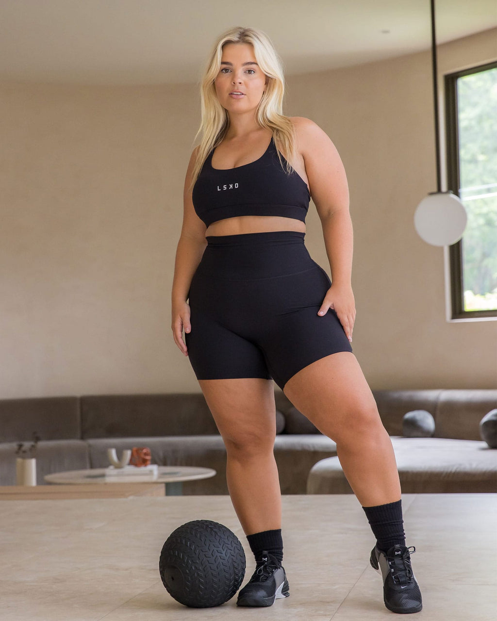 Model wearing Elixir Mid Short Tight - Black