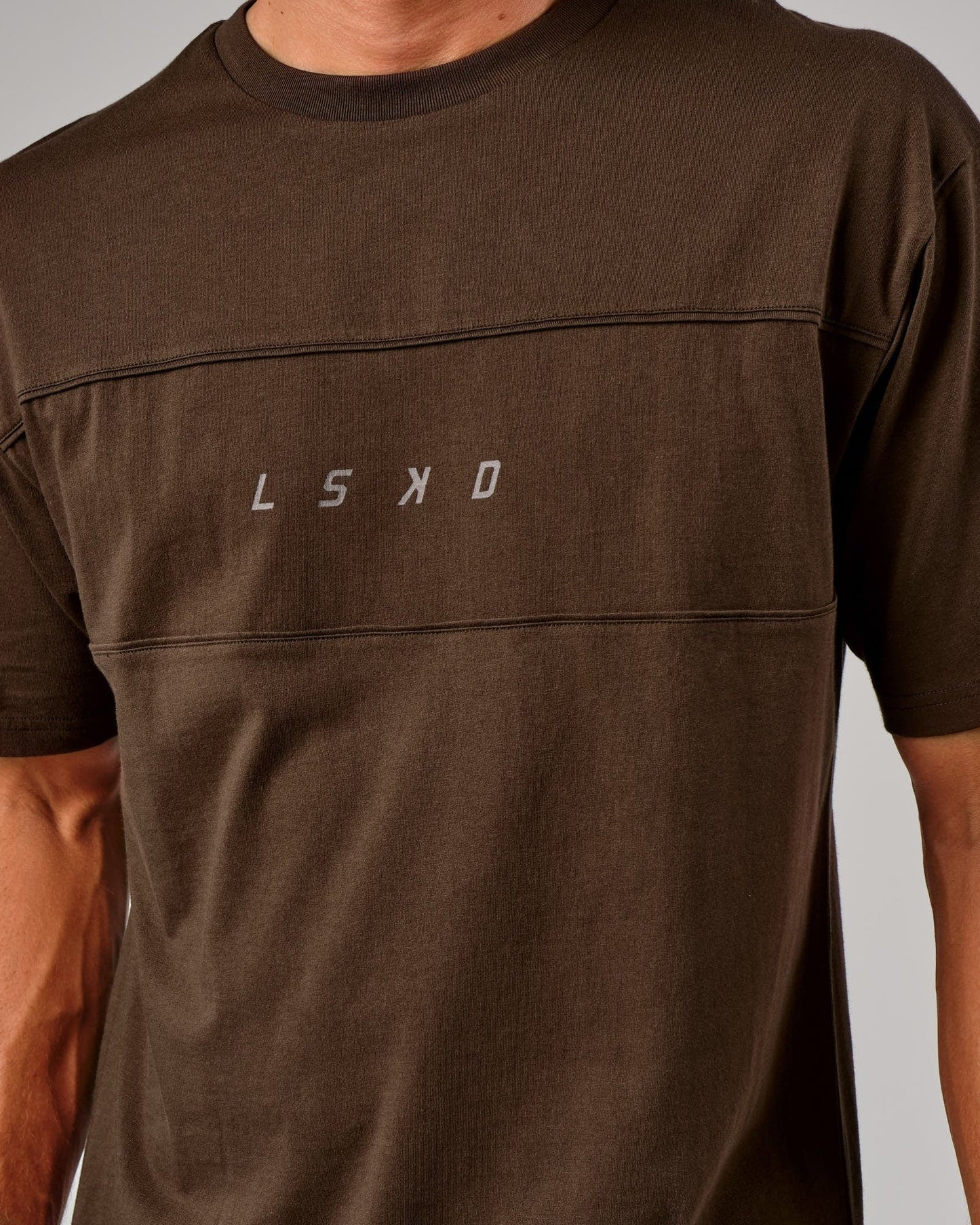 Model wearing Ascent Tee Oversize - Walnut