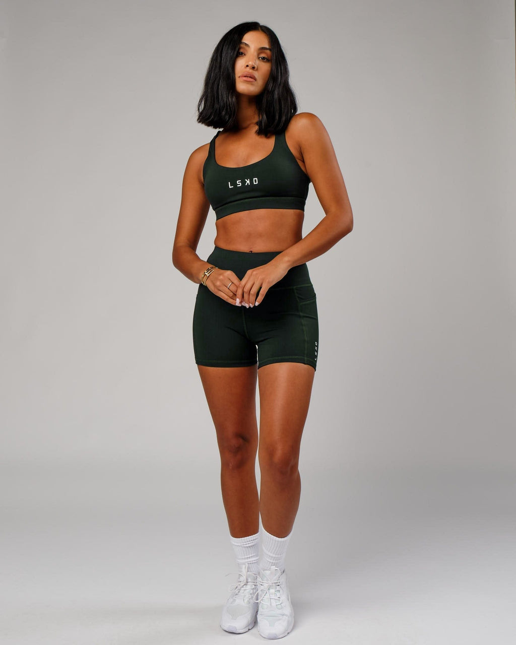 Model wearing Rep Sports Bra Small Logo - Forest