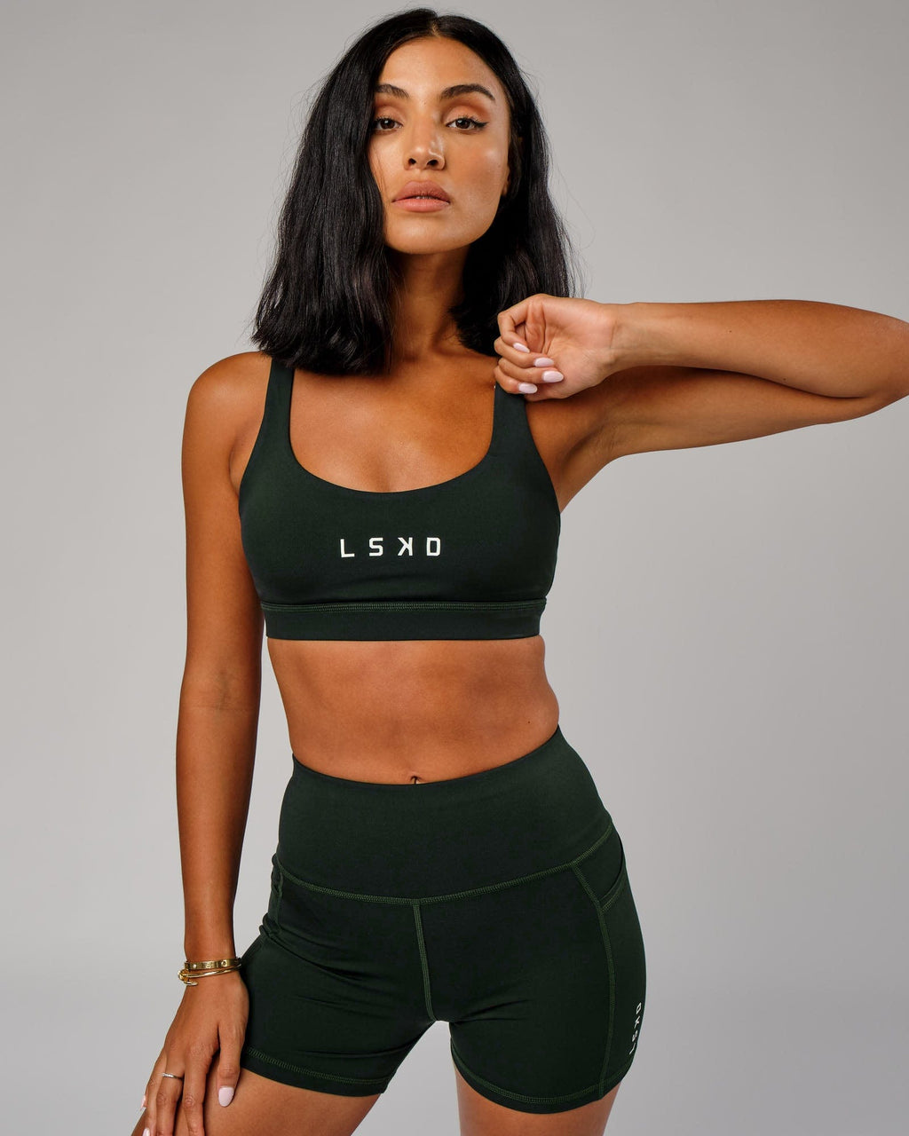 Model wearing Rep Sports Bra Small Logo - Forest