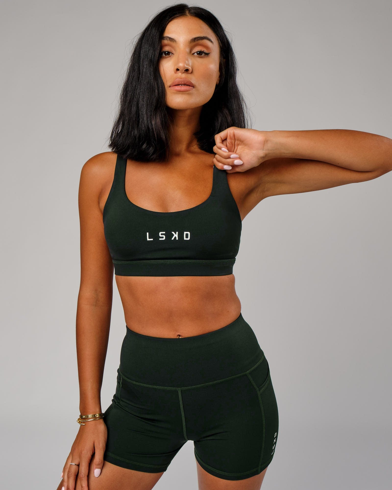 Model wearing Rep Sports Bra Small Logo - Forest