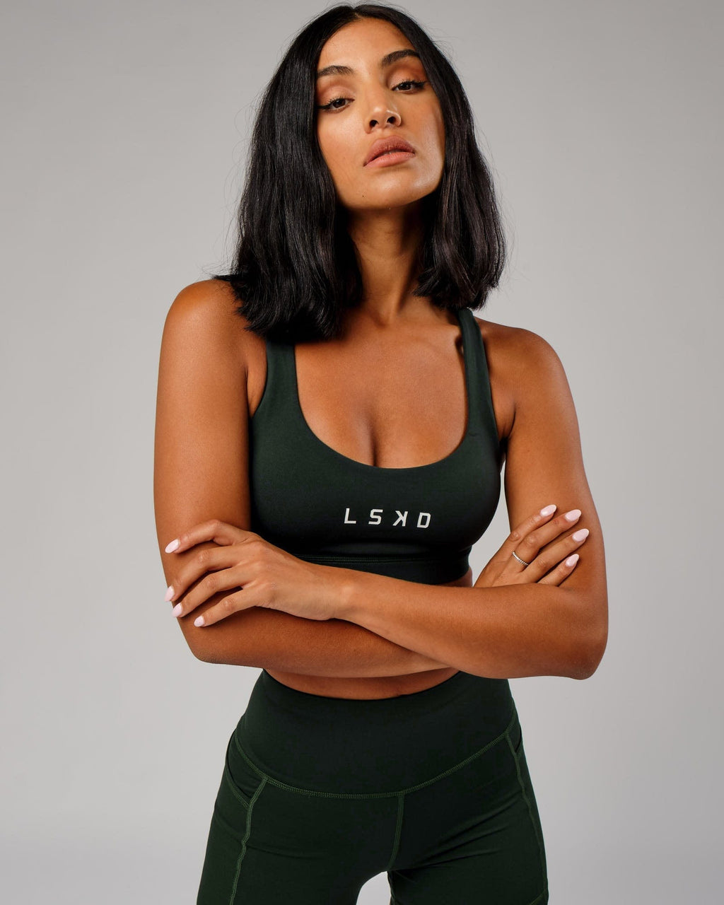 Model wearing Rep Sports Bra Small Logo - Forest