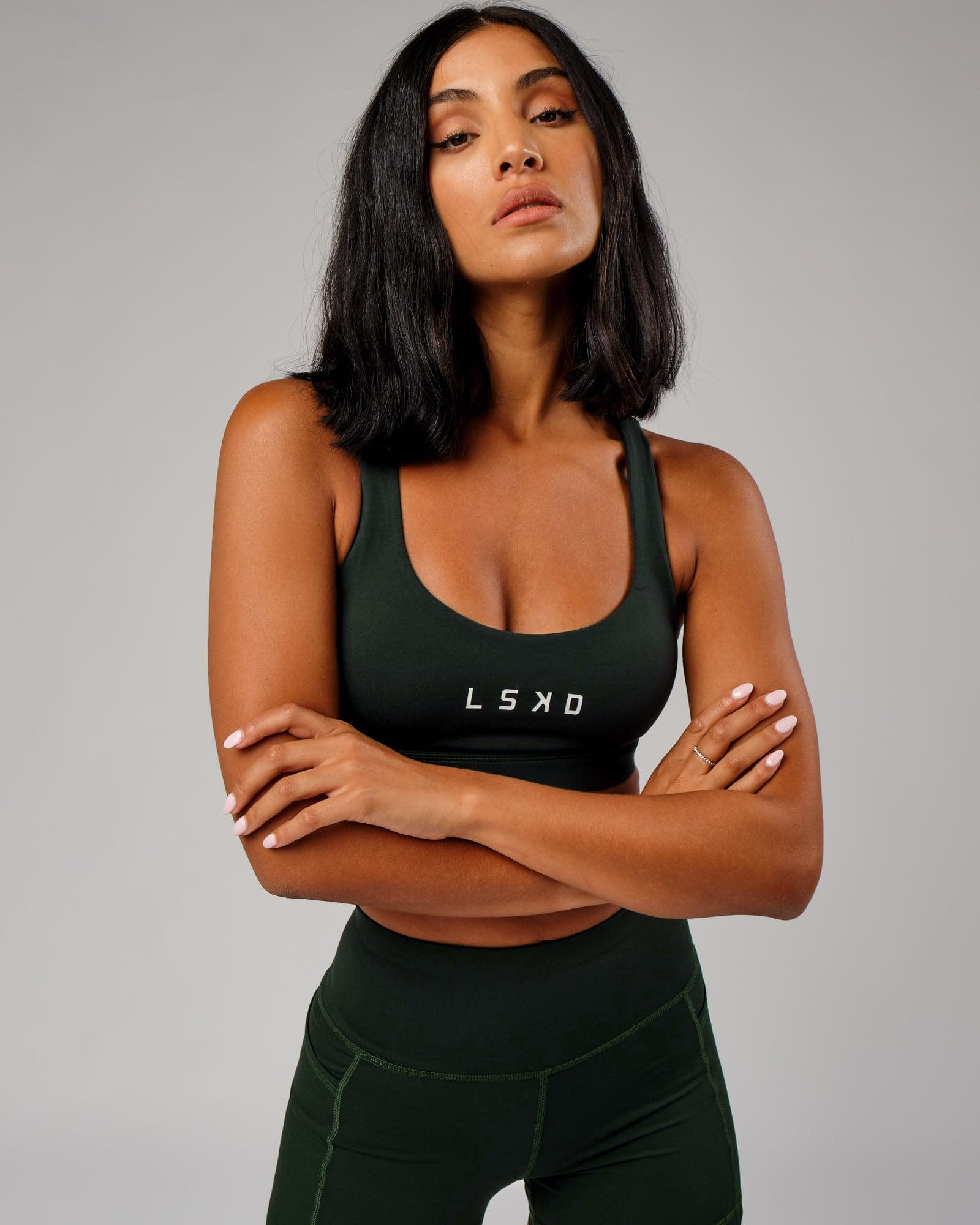 Model wearing Rep Sports Bra Small Logo - Forest