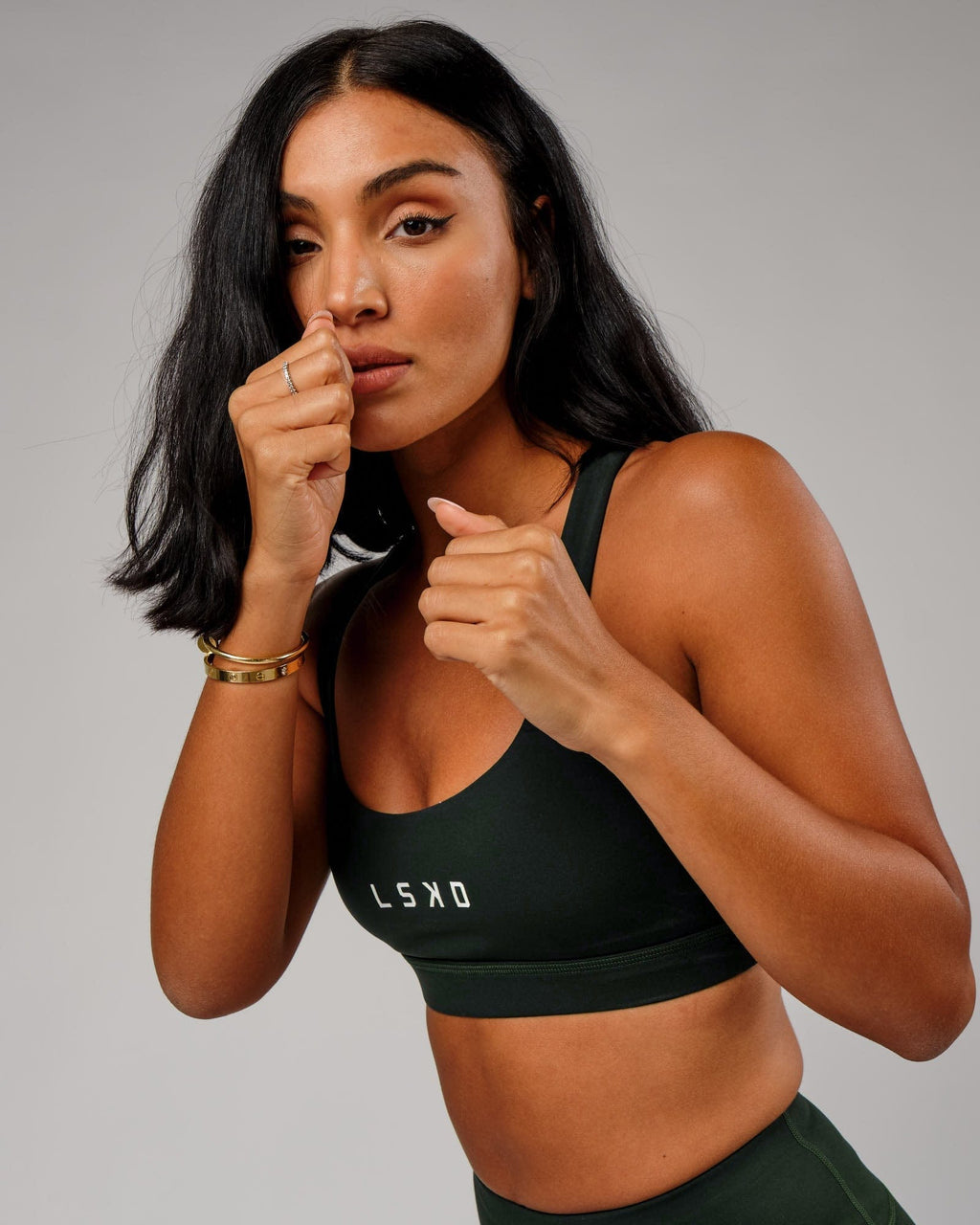 Model wearing Rep Sports Bra Small Logo - Forest