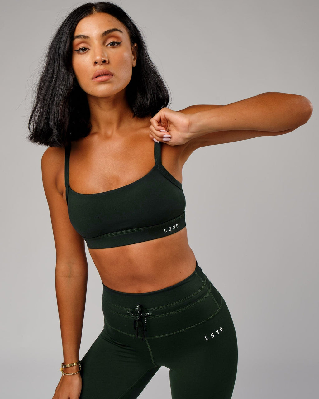 Model wearing Momentum Sports Bra - Forest