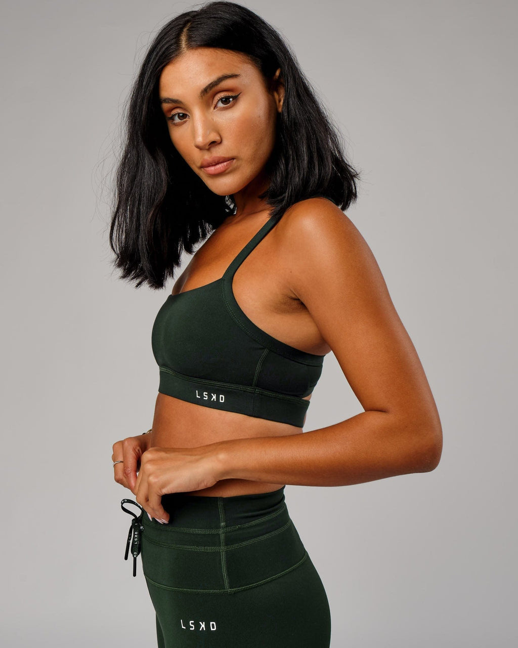Model wearing Momentum Sports Bra - Forest