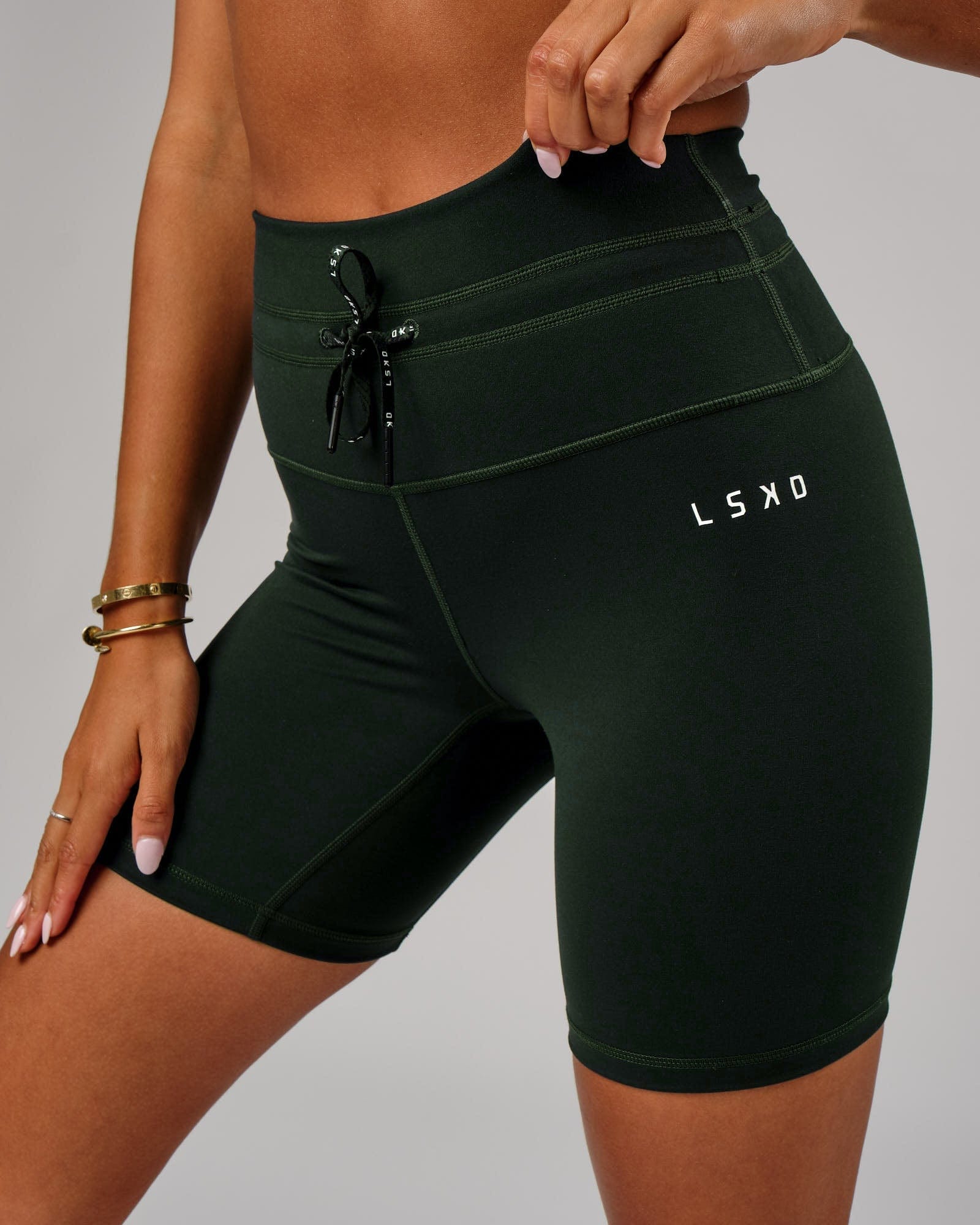 Model wearing Lace Up Mid Short Tight - Forest