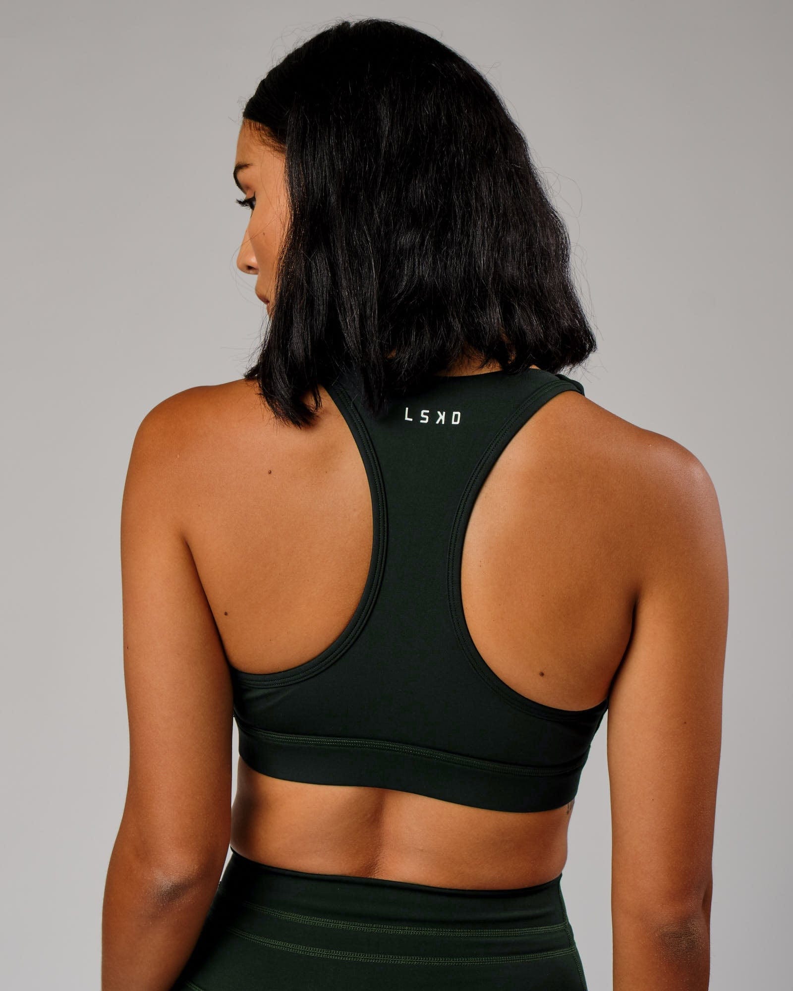 Model wearing Ignite Sports Bra - Forest