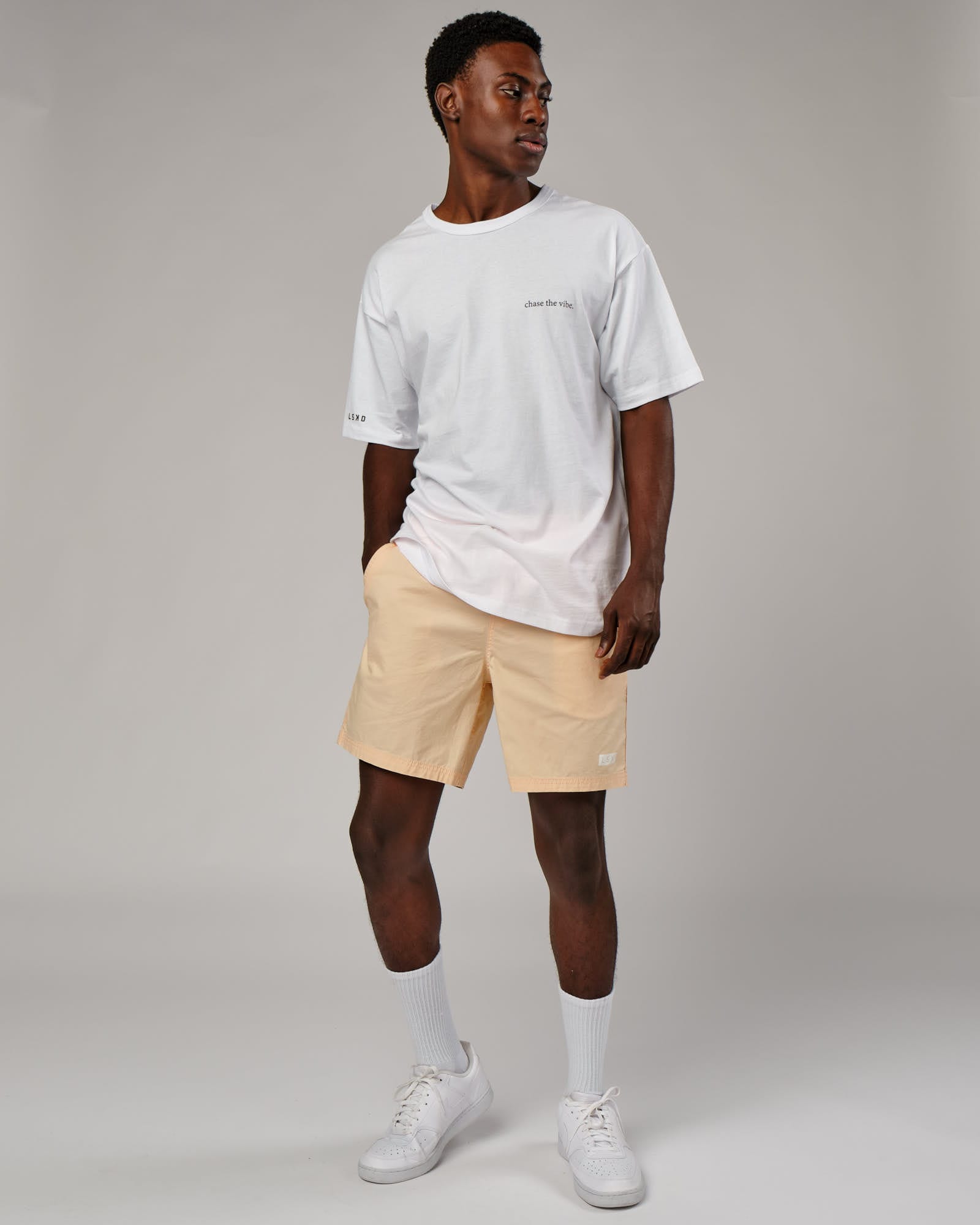 Model wearing Daily Short - Pastel Orange