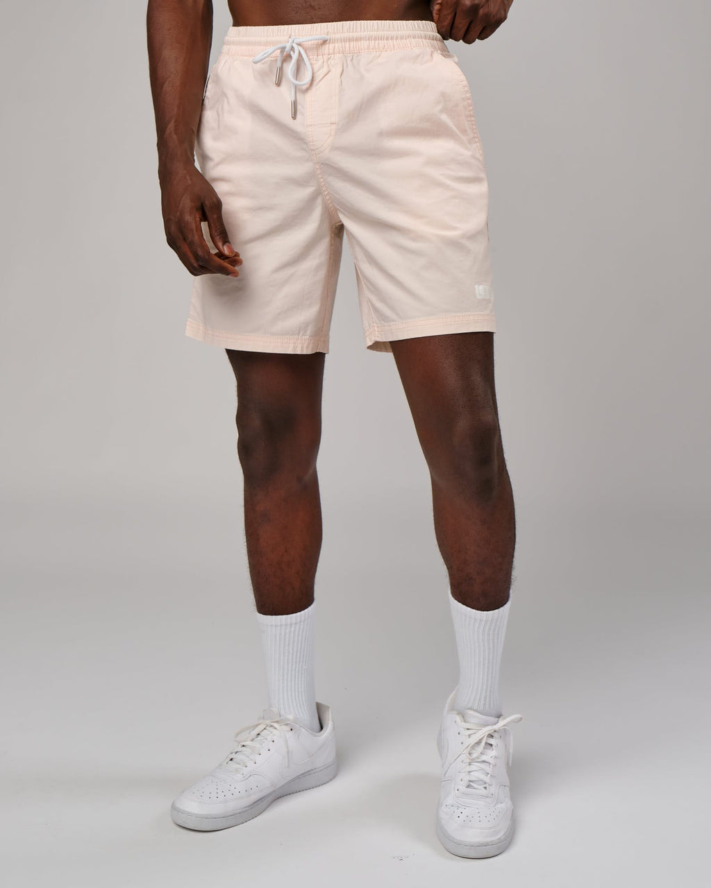 Model wearing Daily Short - Pastel Pink