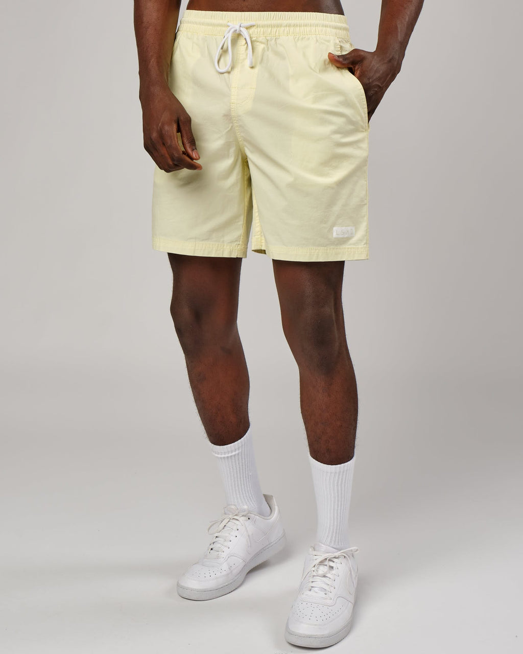 Model wearing Daily Short - Pastel Lime