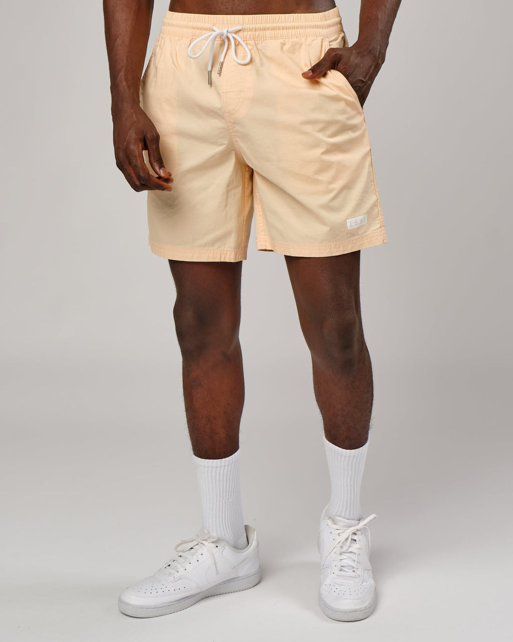 Model wearing Daily Short - Pastel Orange