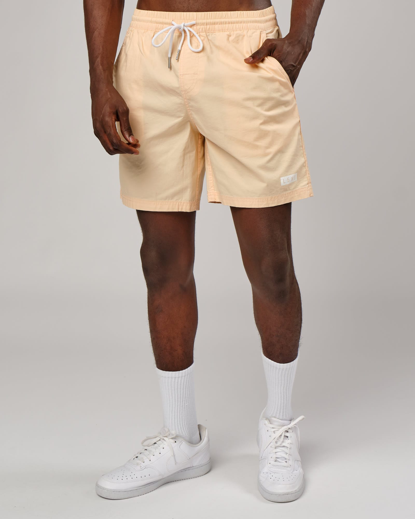 Model wearing Daily Short - Pastel Orange
