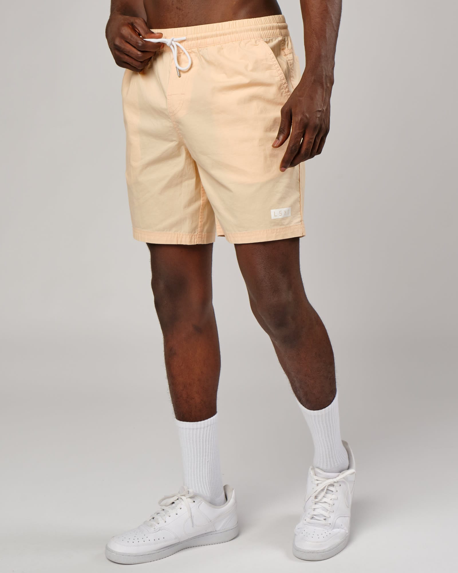 Model wearing Daily Short - Pastel Orange