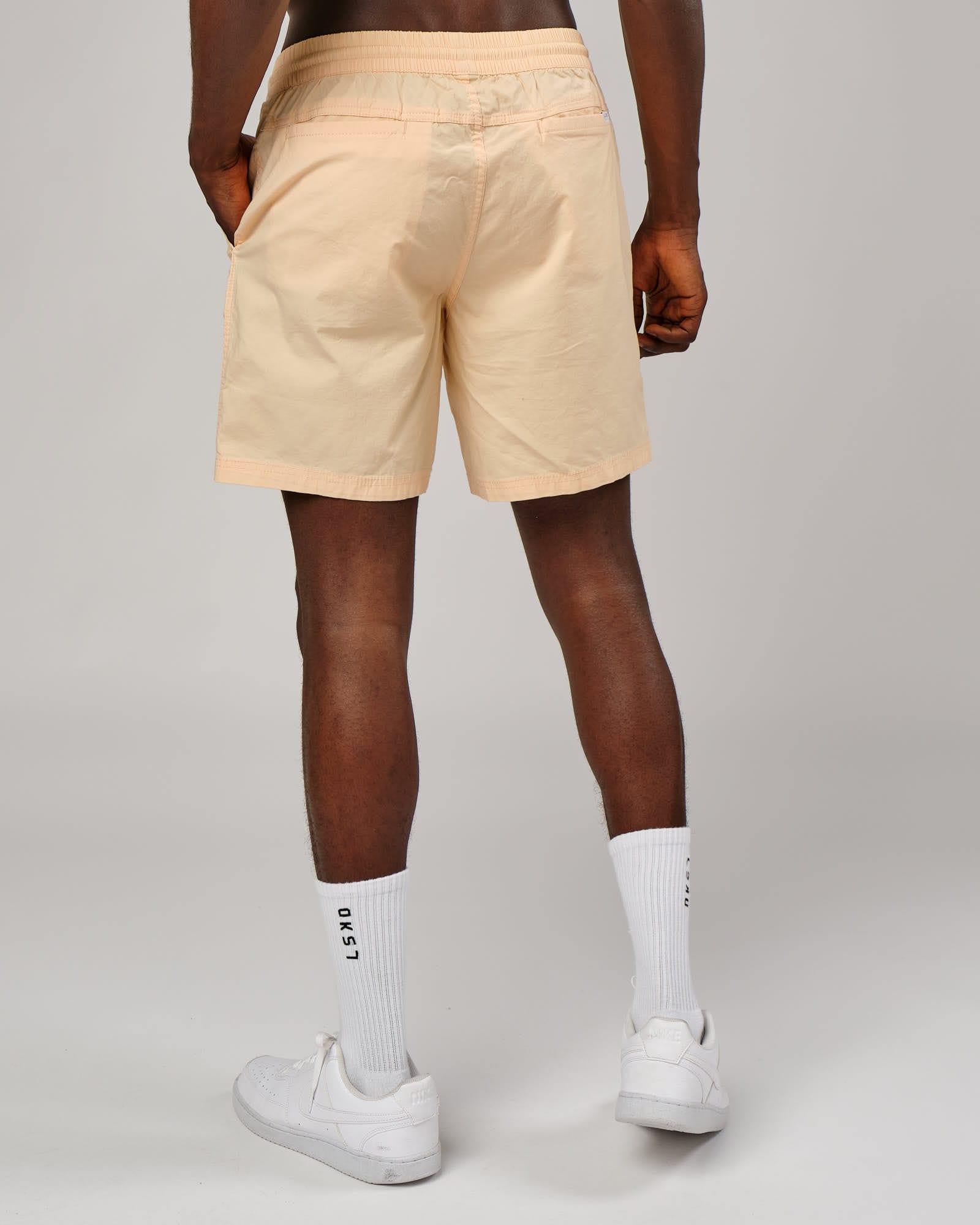 Model wearing Daily Short - Pastel Orange