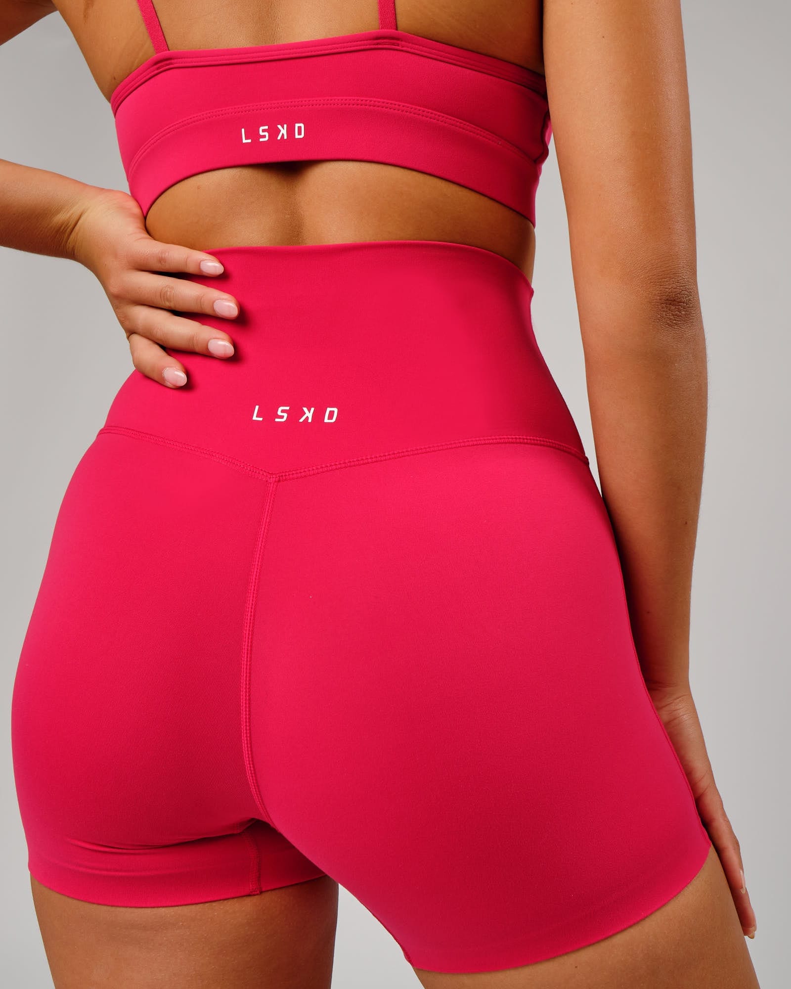 Model wearing Elixir X-Short Tight - Boysenberry No Logo