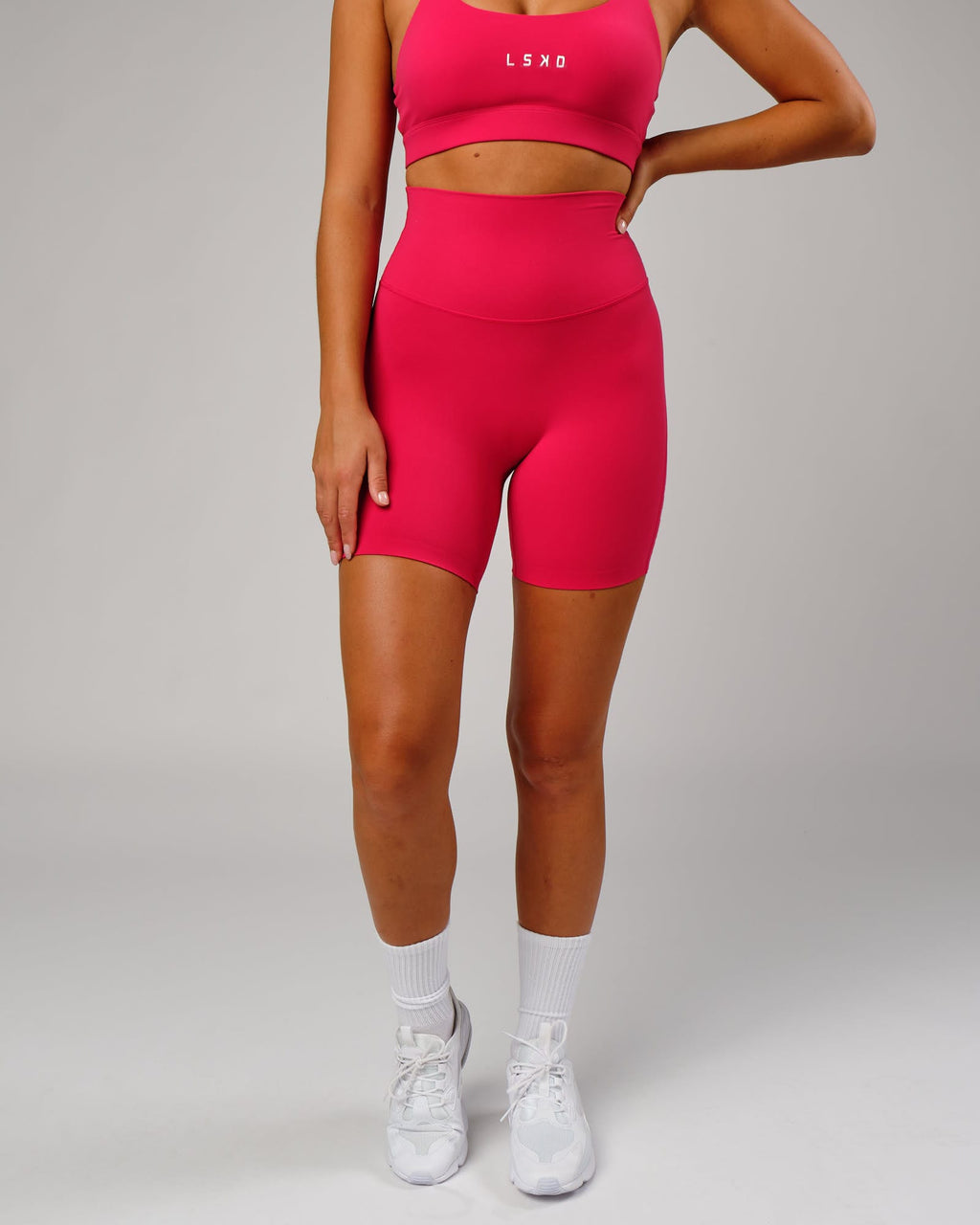 Model wearing Elixir Mid Short Tight - Boysenberry