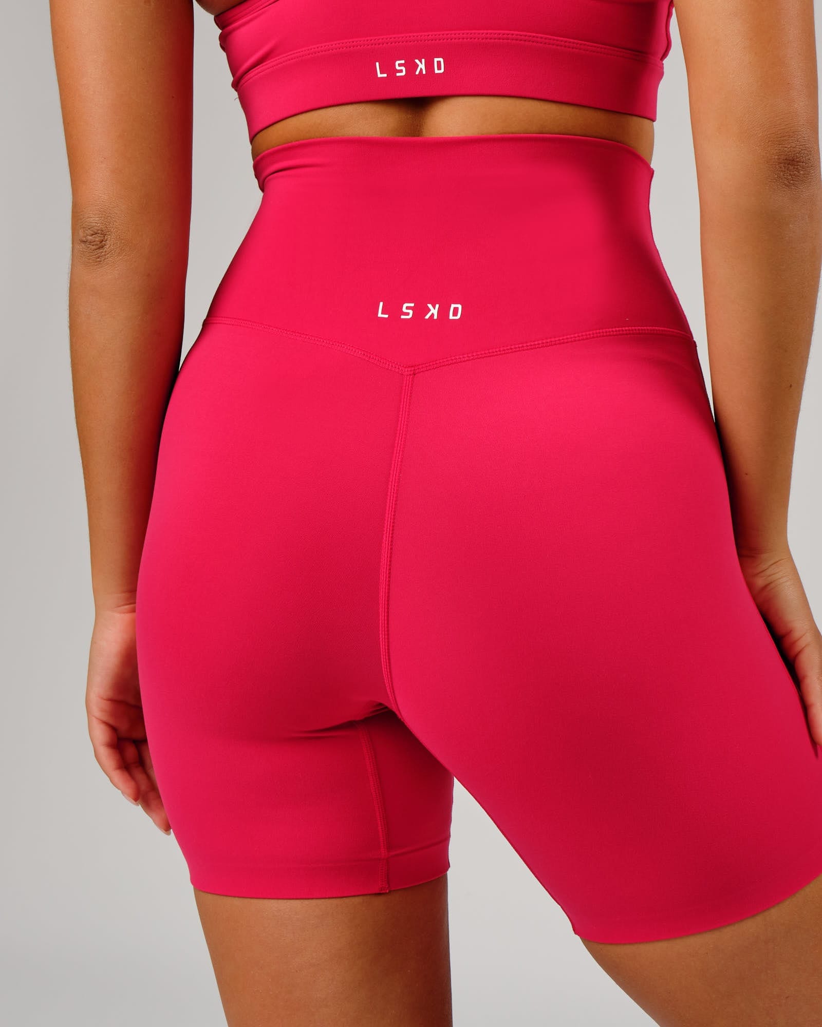 Model wearing Elixir Mid Short Tight - Boysenberry