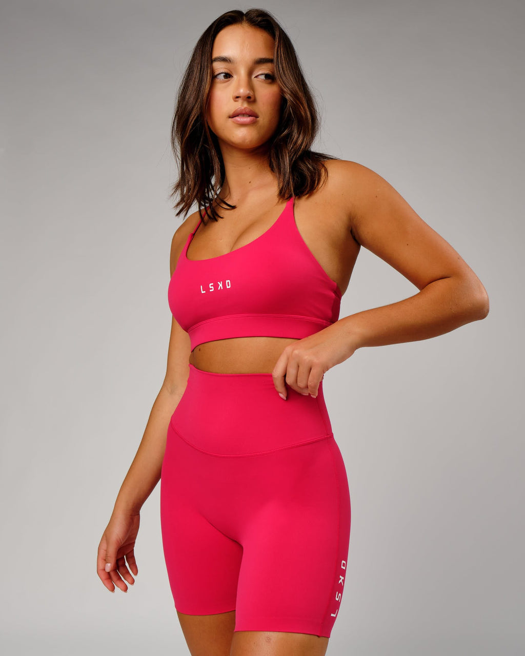 Model wearing Elixir Mid Short Tight - Boysenberry