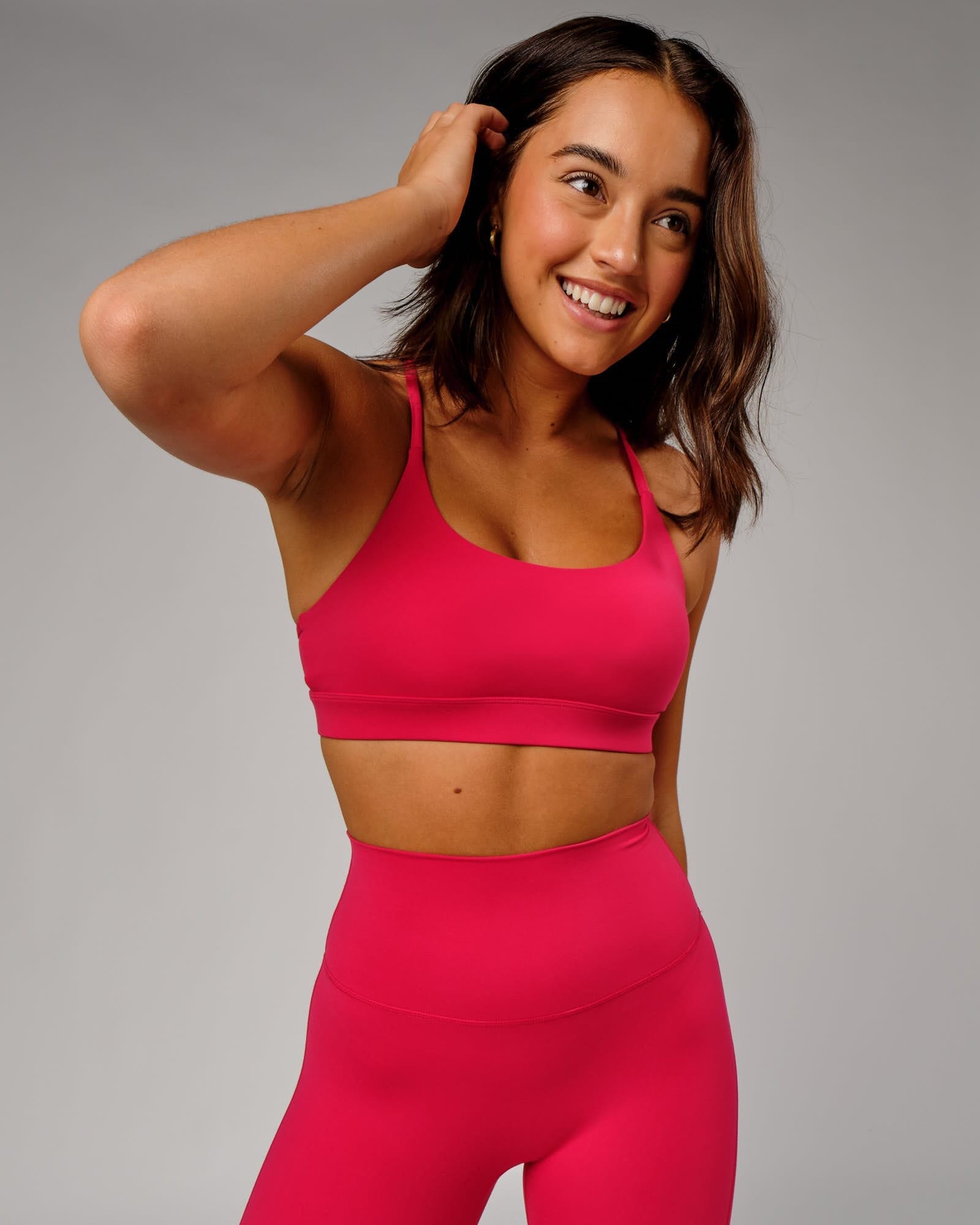 Model wearing Elixir Sports Bra - Boysenberry