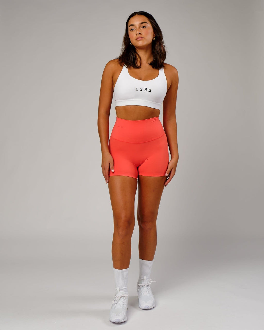 Model wearing Rep Sports Bra Small Logo - White-Black