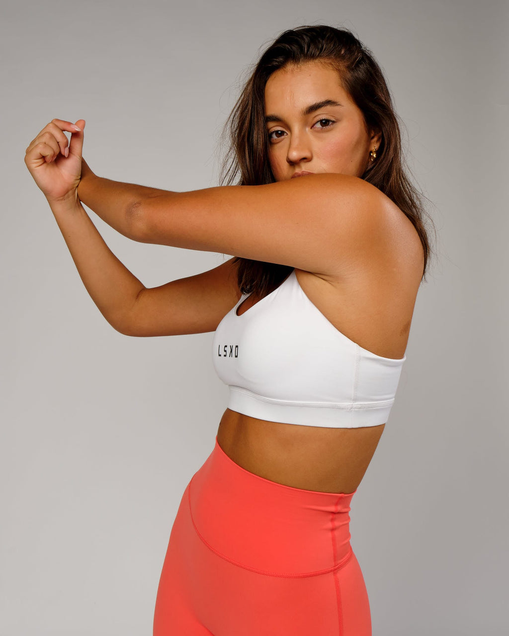 Model wearing Rep Sports Bra Small Logo - White-Black