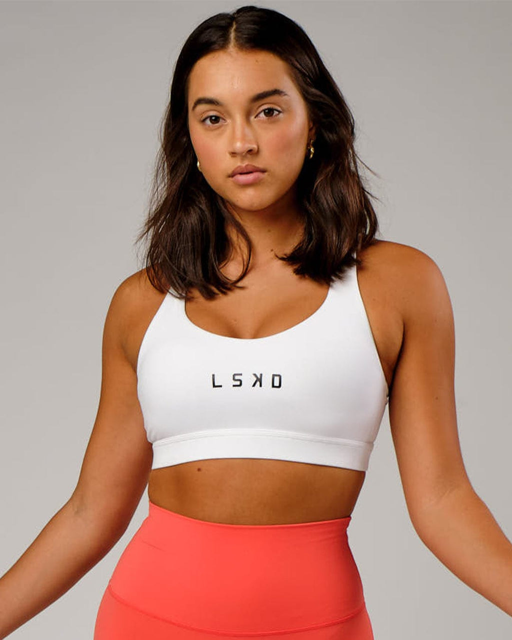Model wearing Rep Sports Bra Small Logo - White-Black