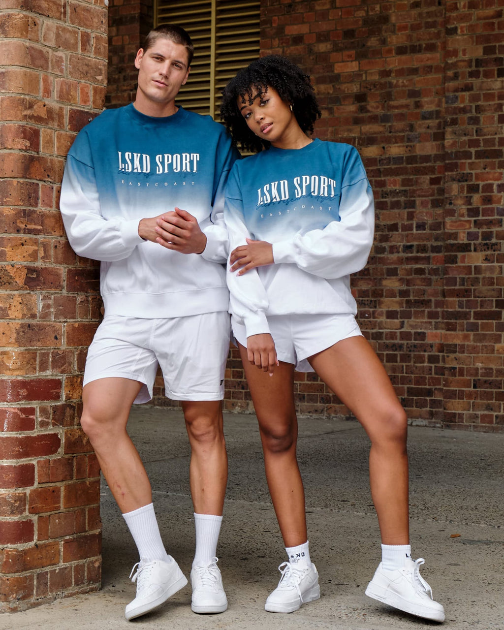 Model wearing Unisex Gradient Sweater - Atlantic-White