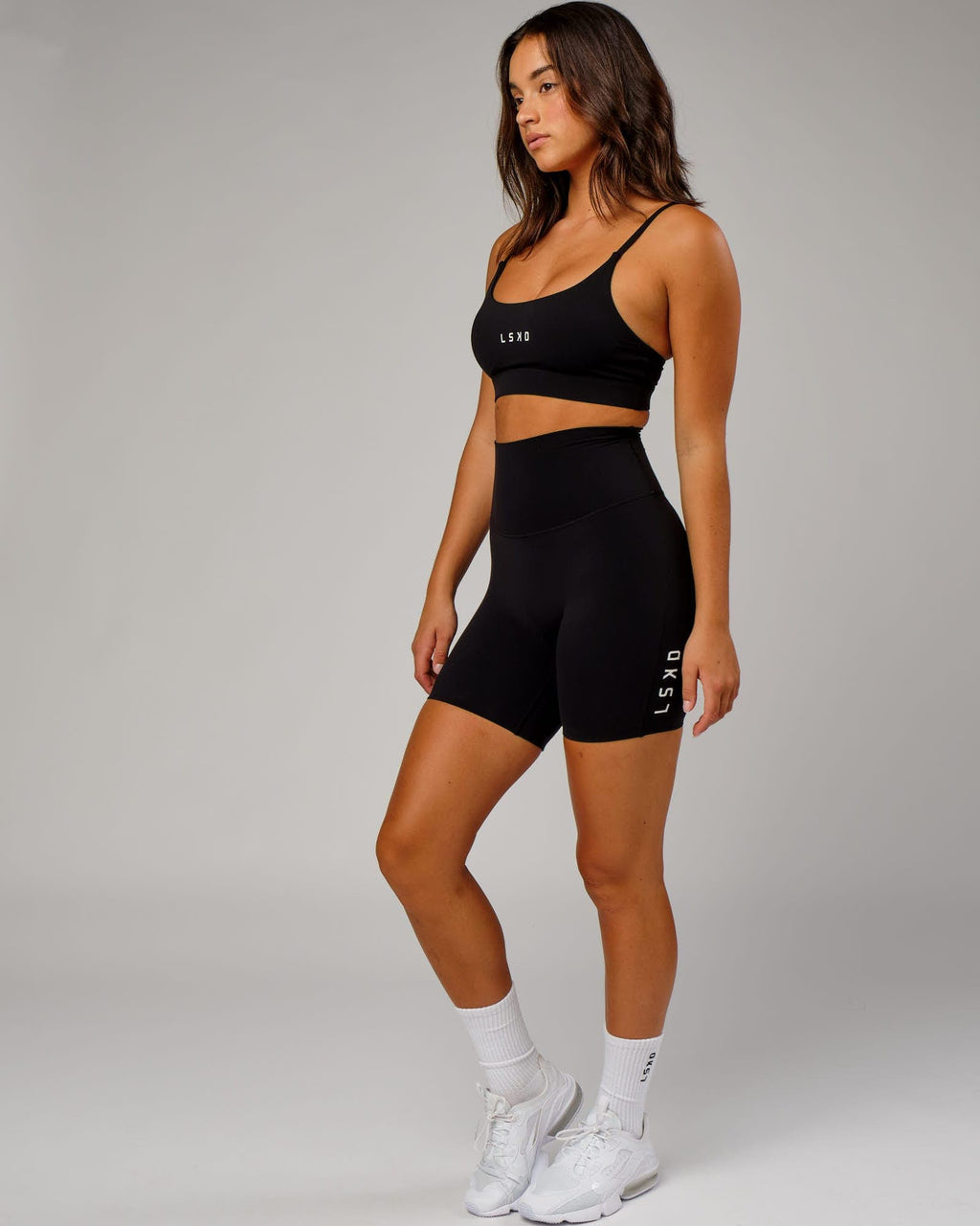 Model wearing Elixir Mid Short Tight - Black