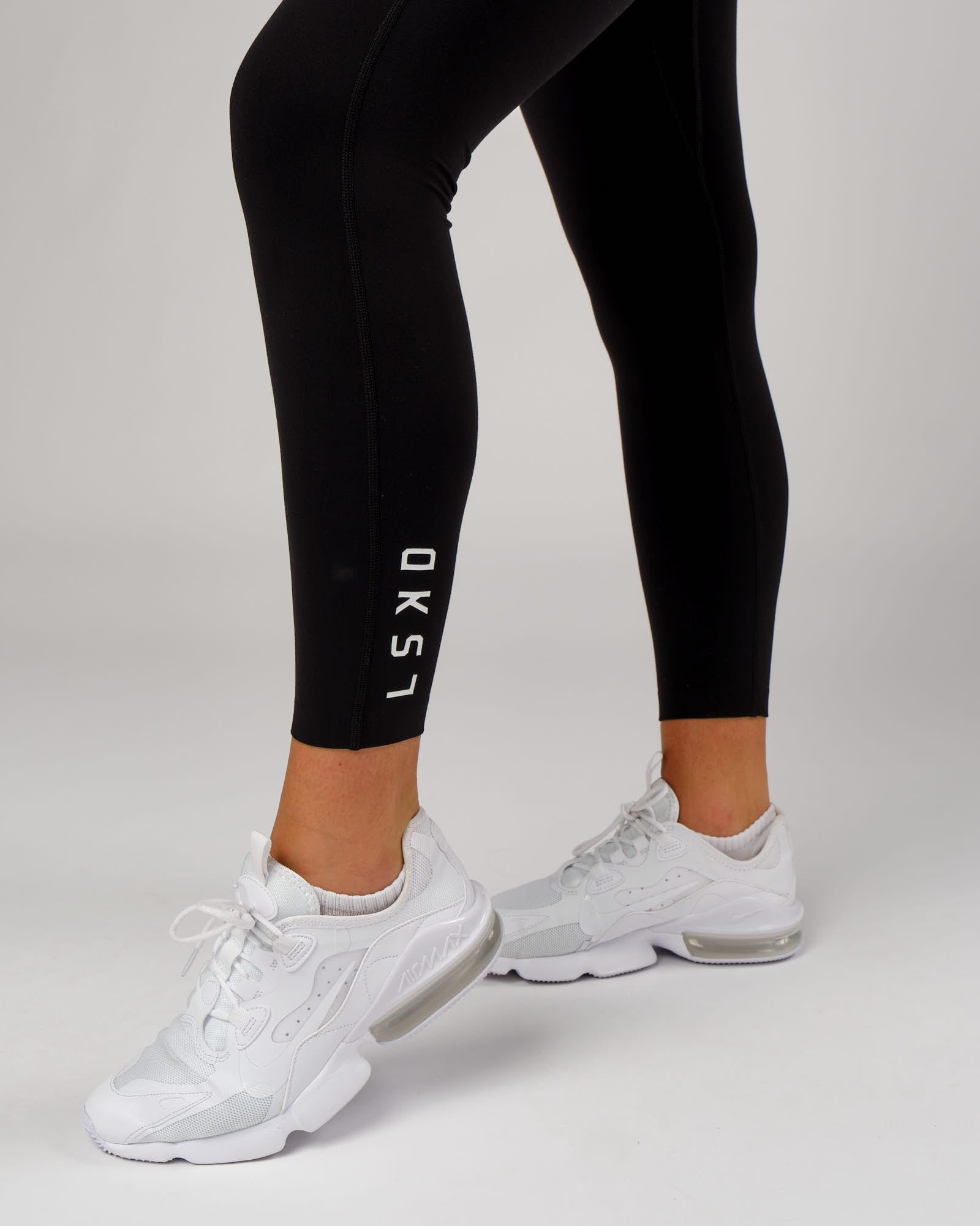 Model wearing Elixir Full Length Tight - Black