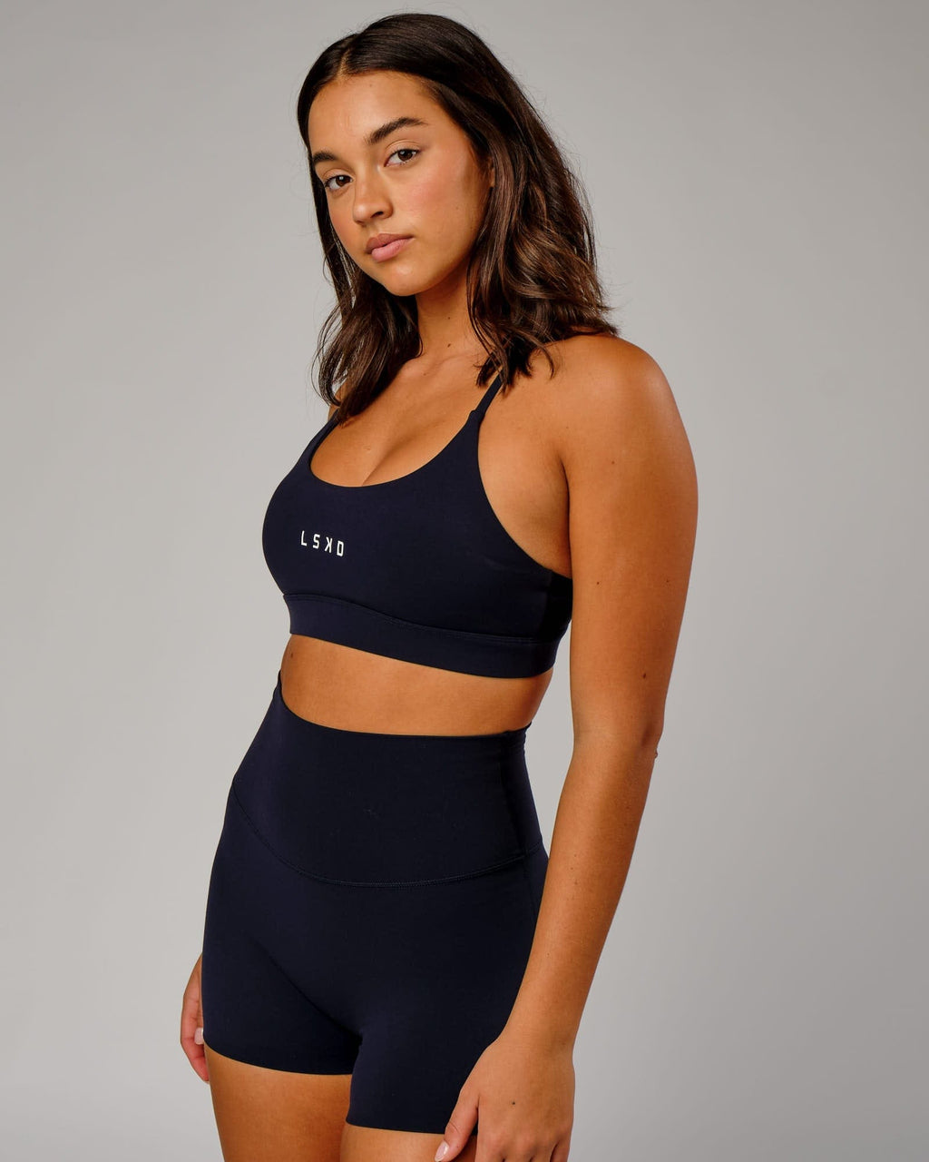 Model wearing Elixir Sports Bra - Navy
