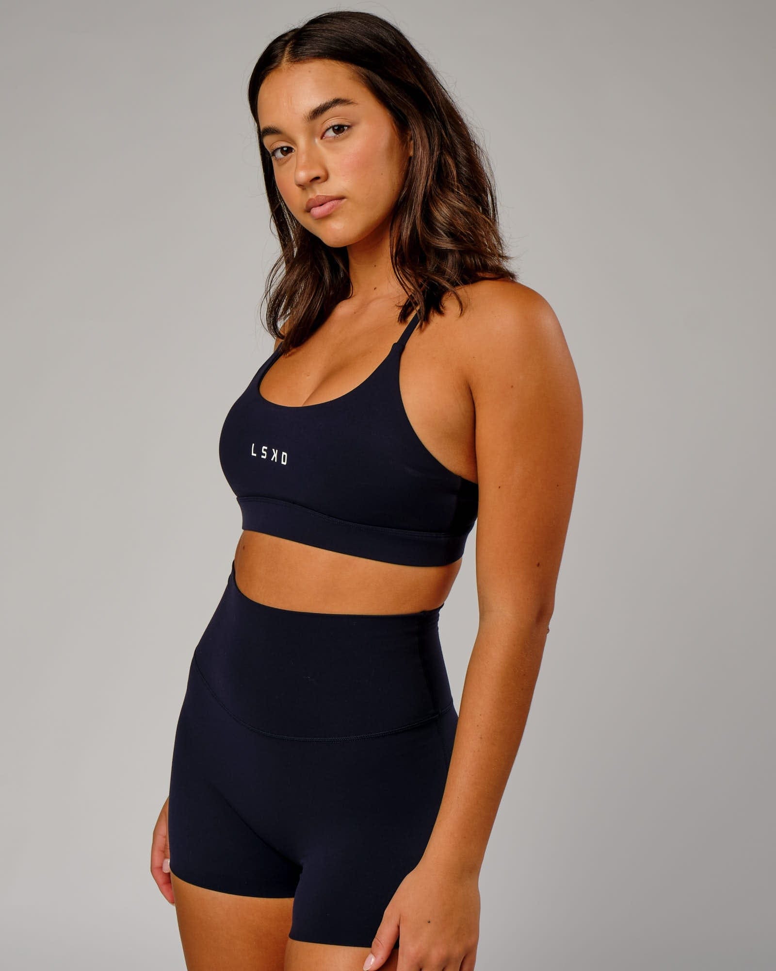 Model wearing Elixir Sports Bra - Navy