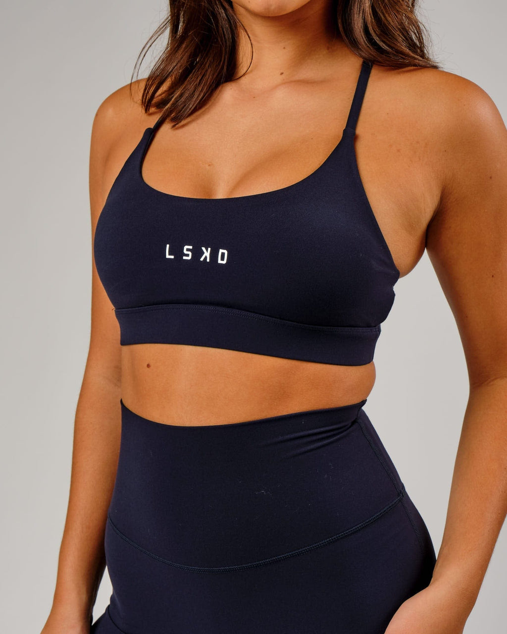 Model wearing Elixir Sports Bra - Navy