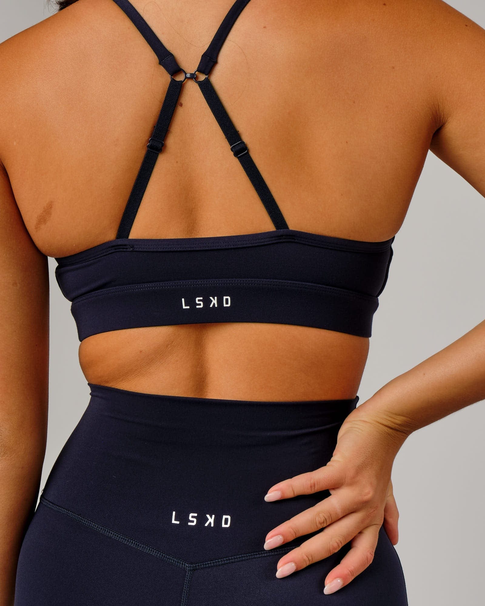 Model wearing Elixir Sports Bra - Navy