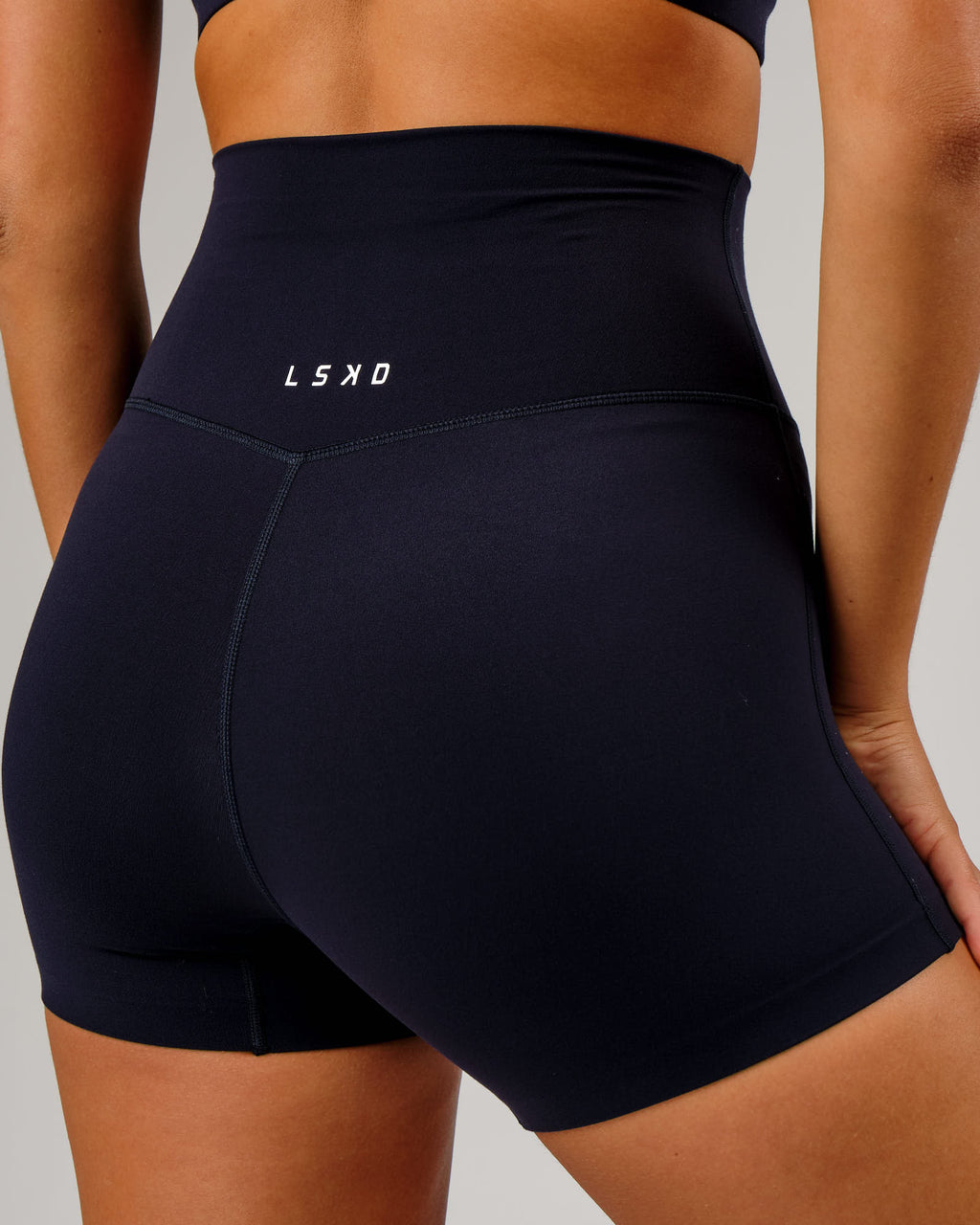 Model wearing Elixir X-Short Tight - Navy