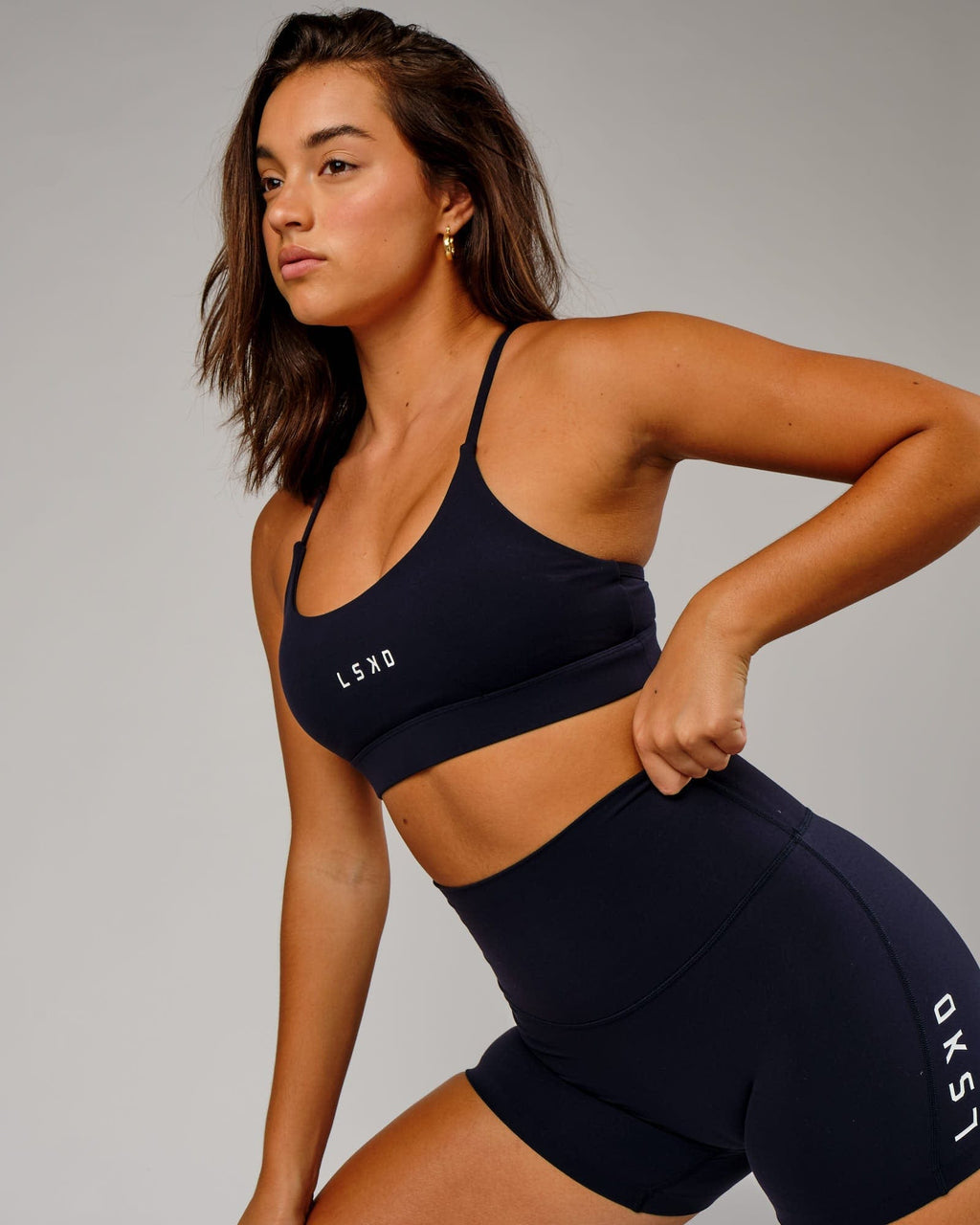 Model wearing Elixir Sports Bra - Navy