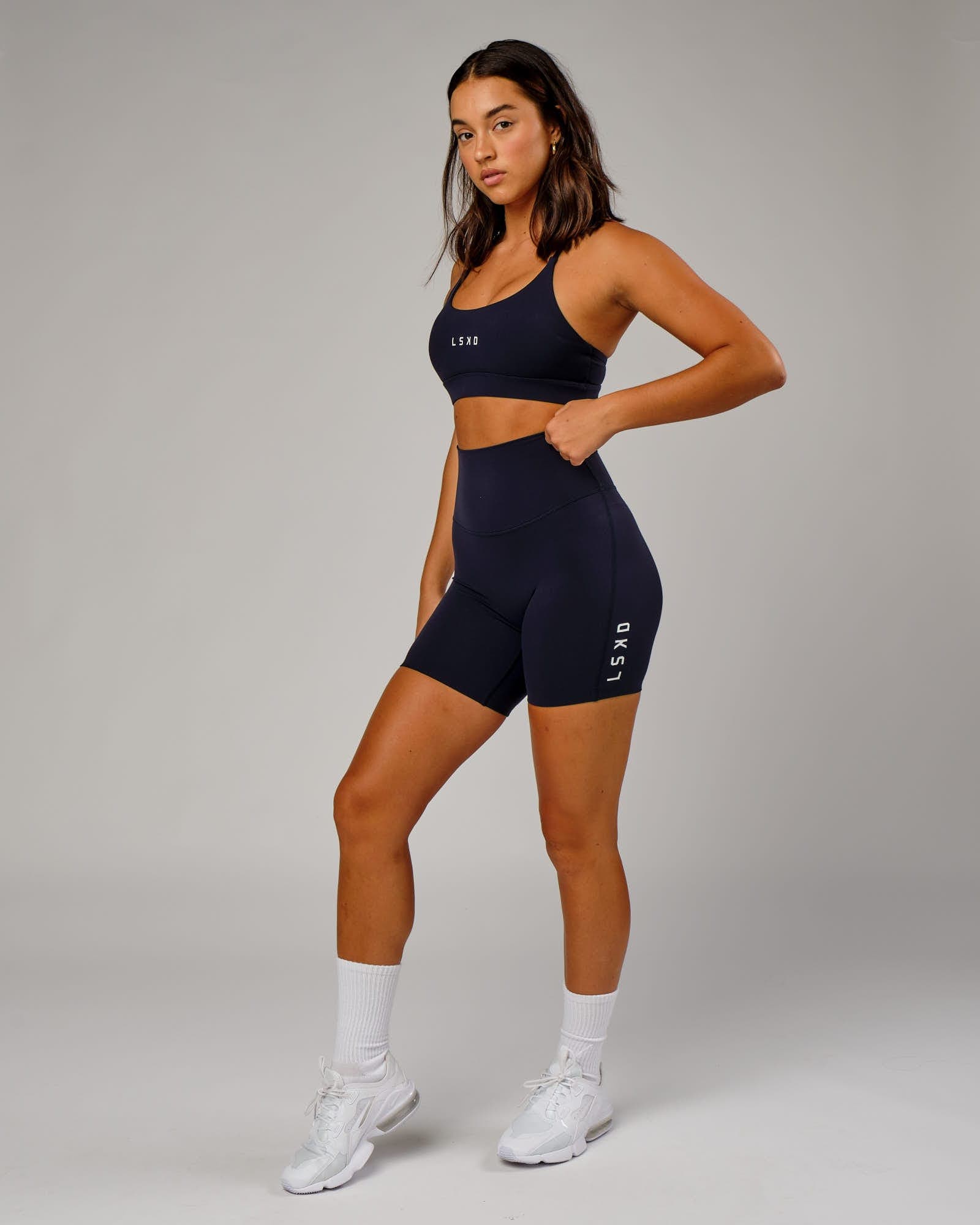 Model wearing Elixir Mid Short Tight - Navy