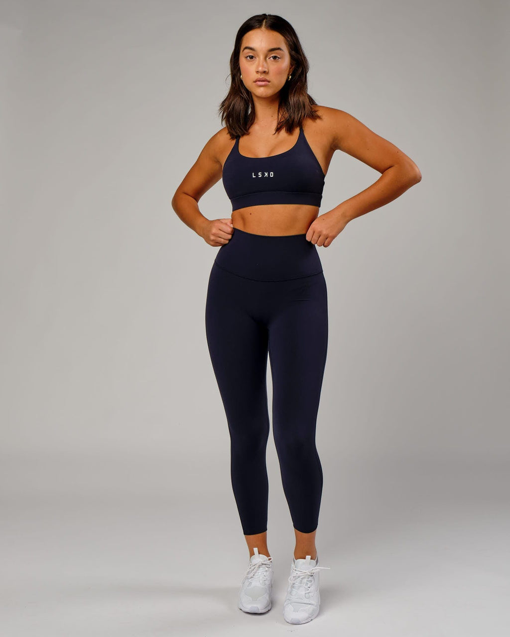 Model wearing Elixir 7/8 Length Tight - Navy