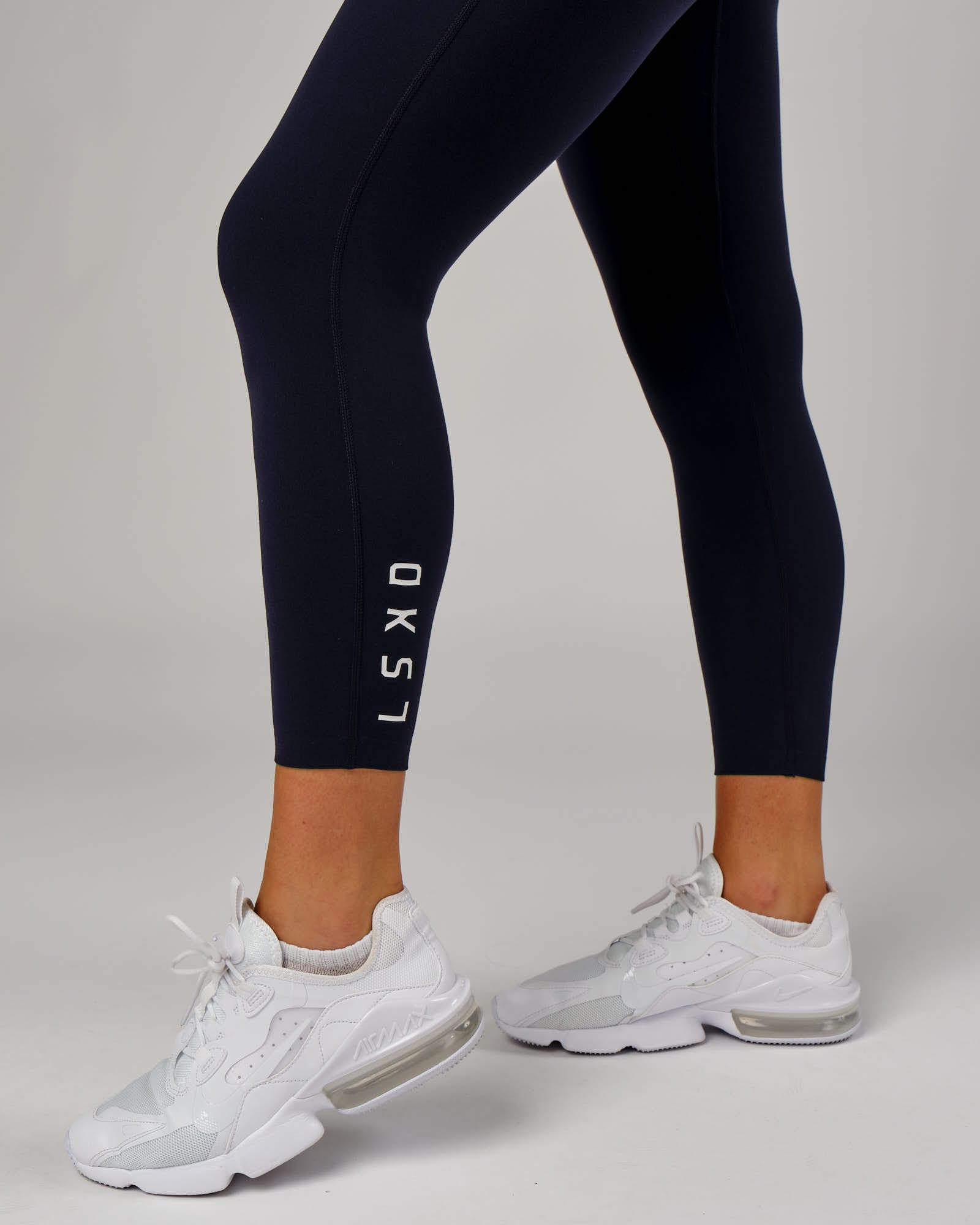 Model wearing Elixir 7/8 Length Tight - Navy