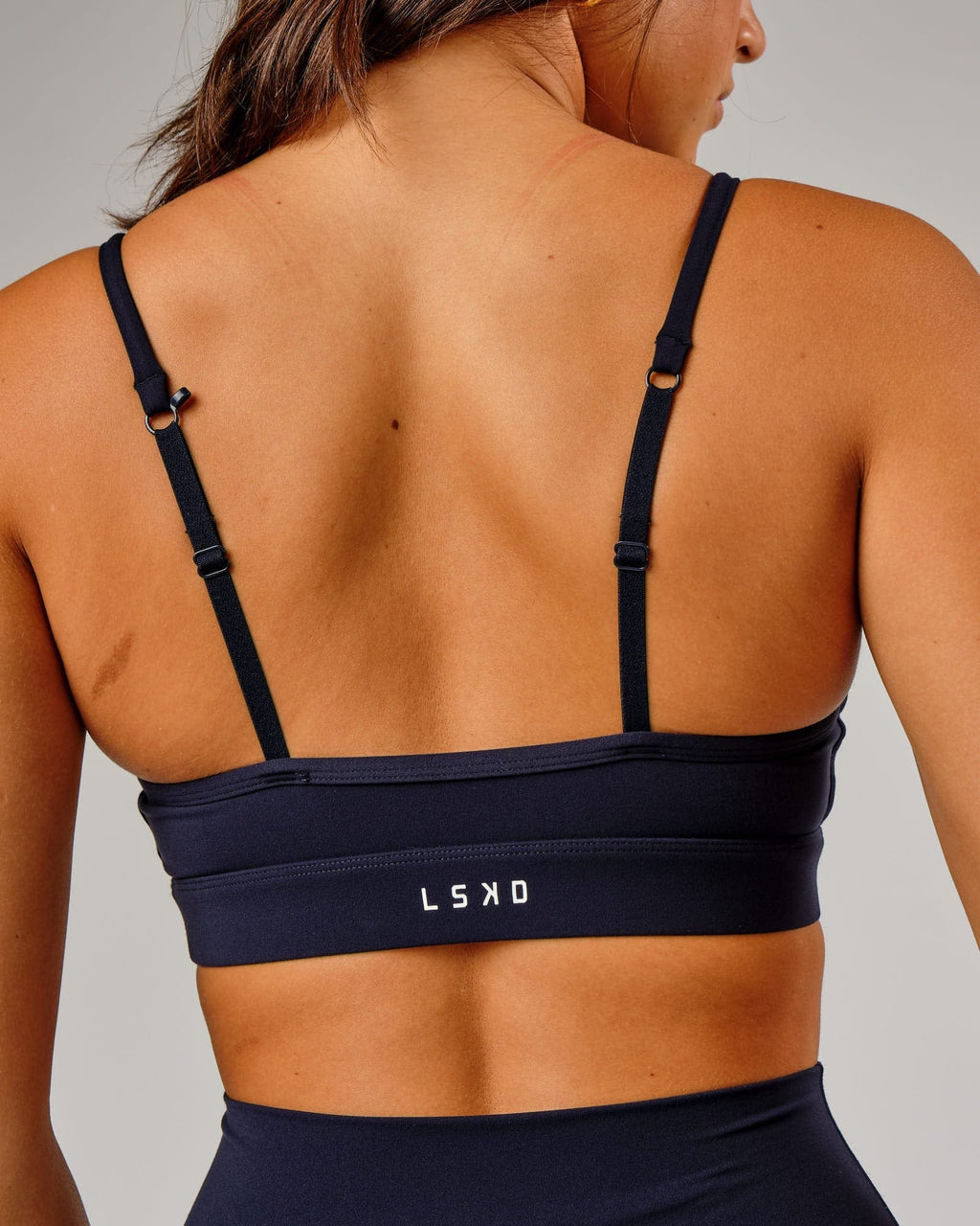 Model wearing Elixir Sports Bra - Navy