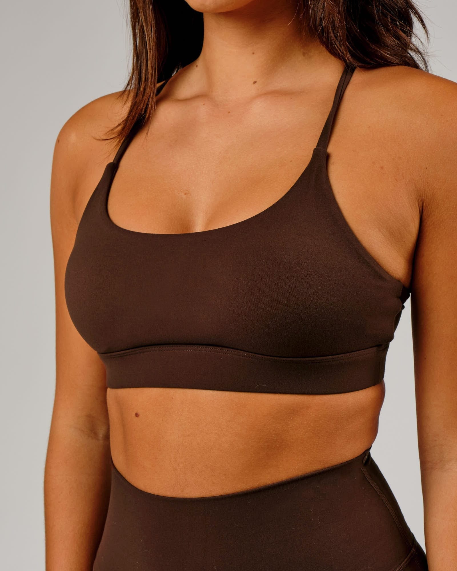 Model wearing Elixir Sports Bra - Chocolate