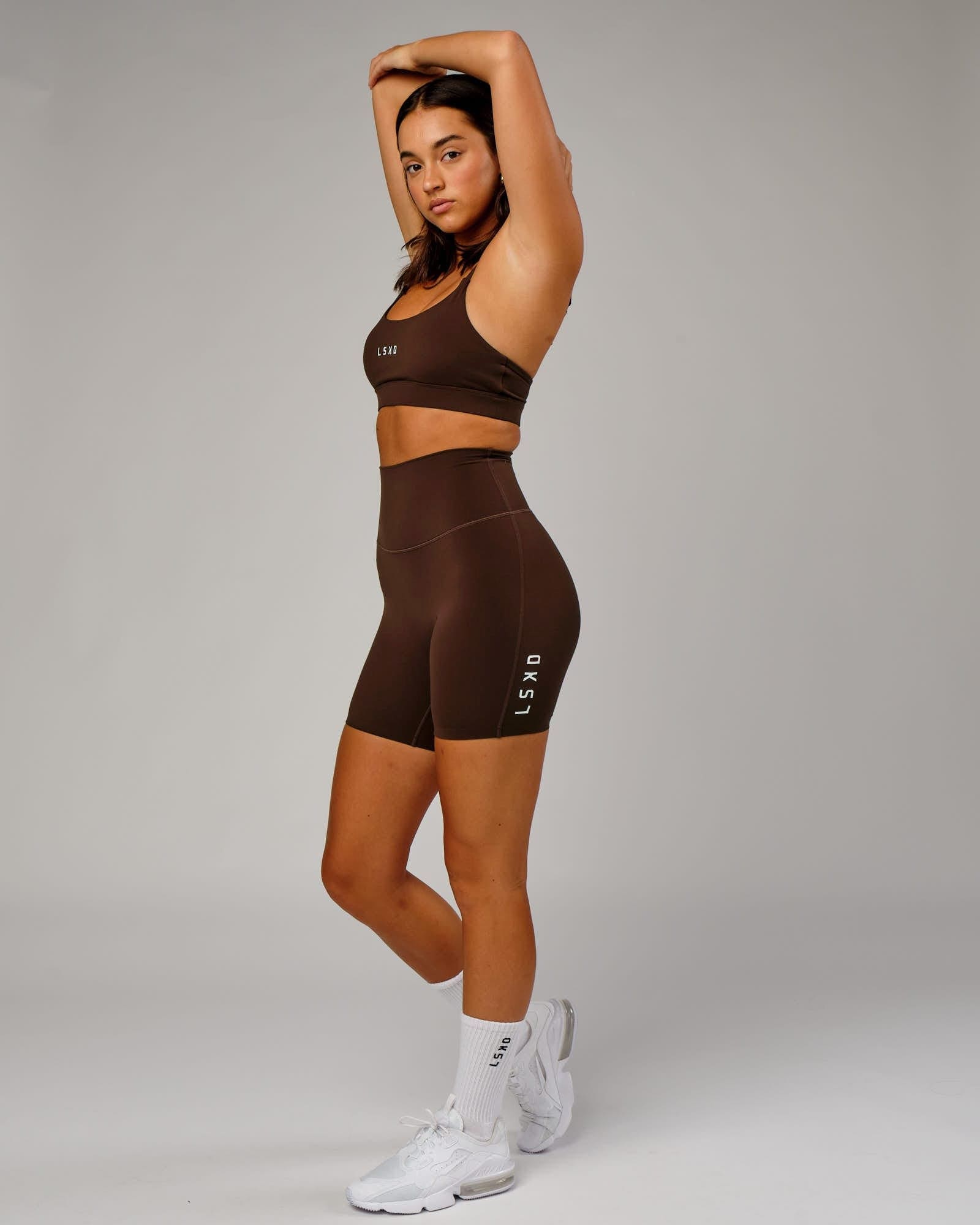 Model wearing Elixir Mid Short Tight - Chocolate