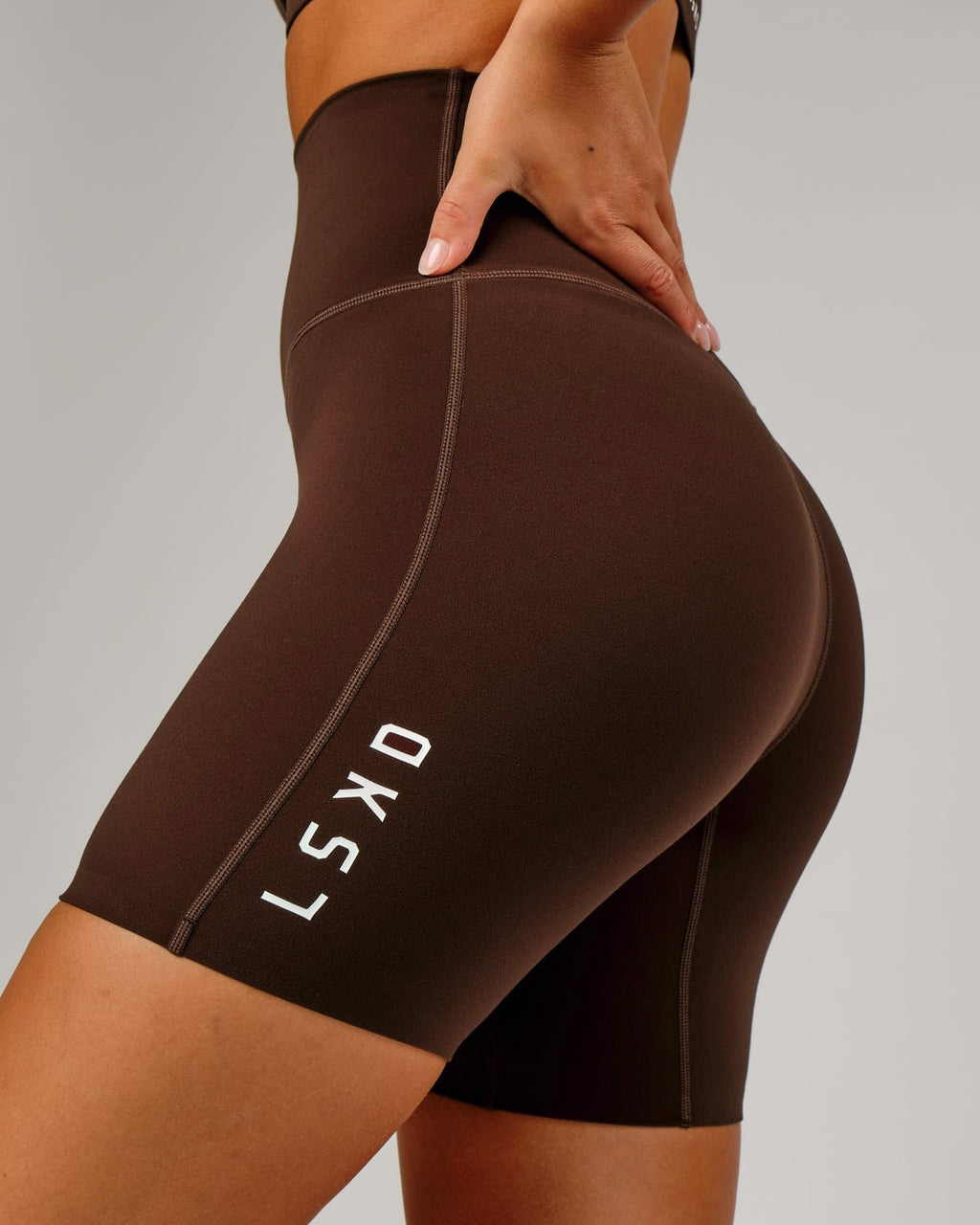 Model wearing Elixir Mid Short Tight - Chocolate