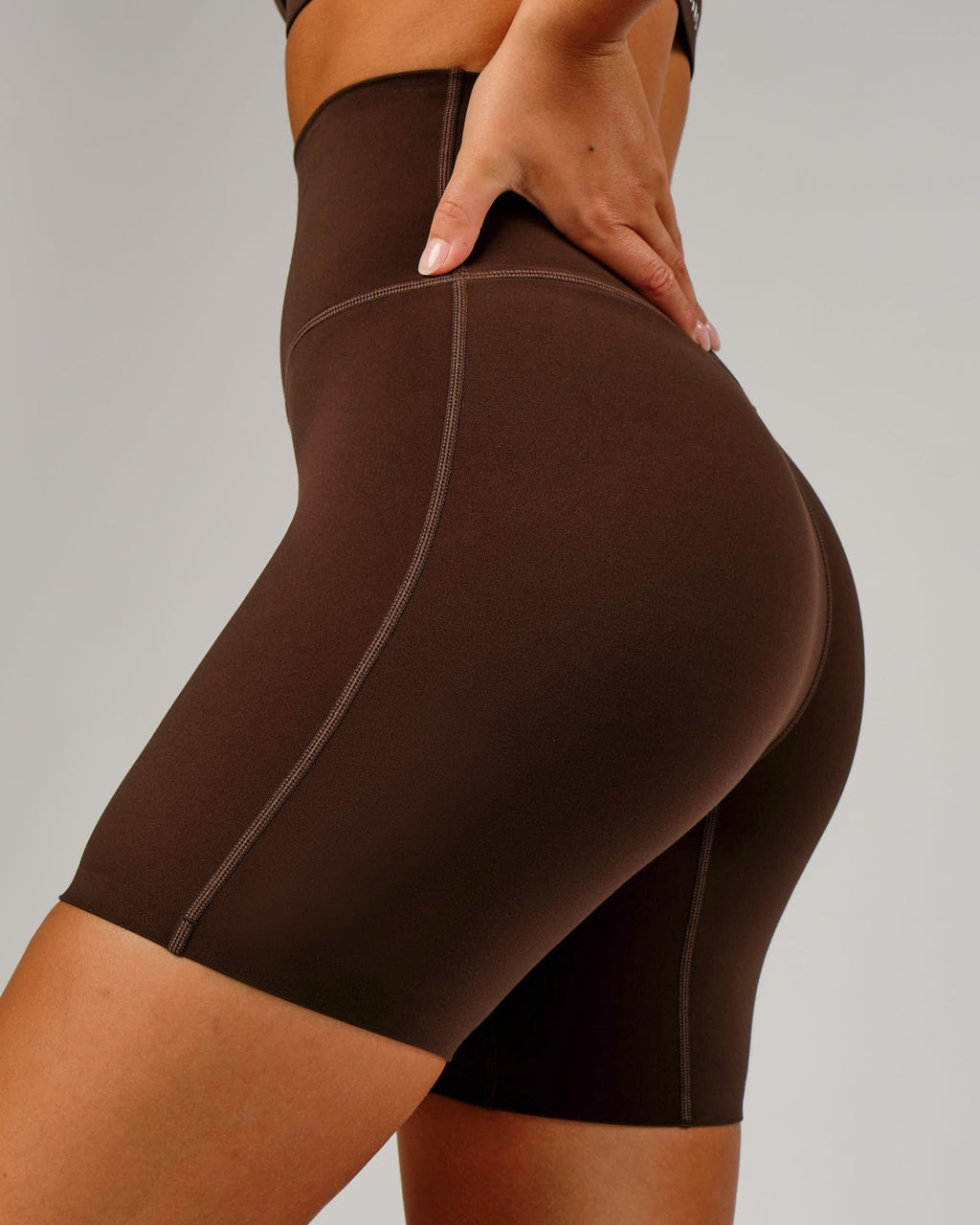 Model wearing Elixir Mid Short Tight - Chocolate No Logo