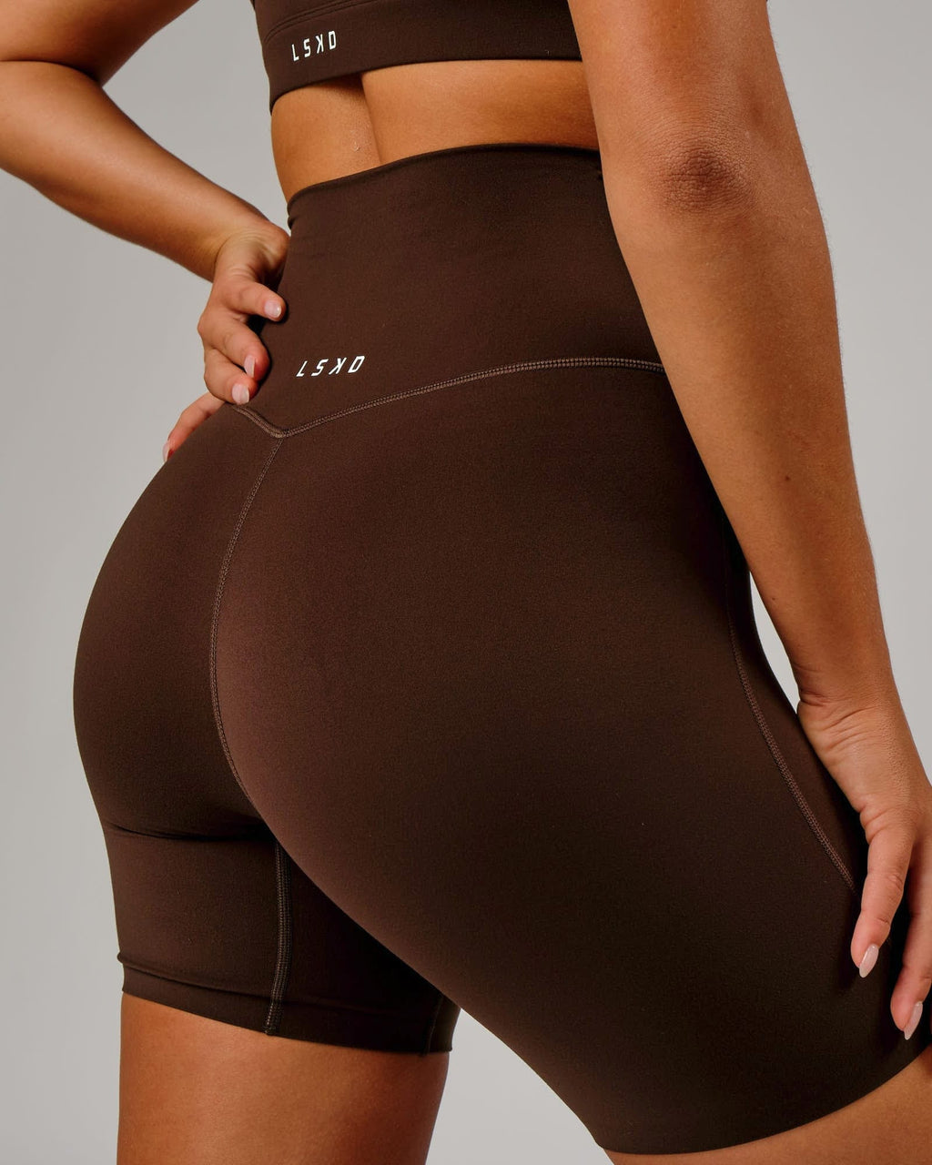 Model wearing Elixir Mid Short Tight - Chocolate No Logo