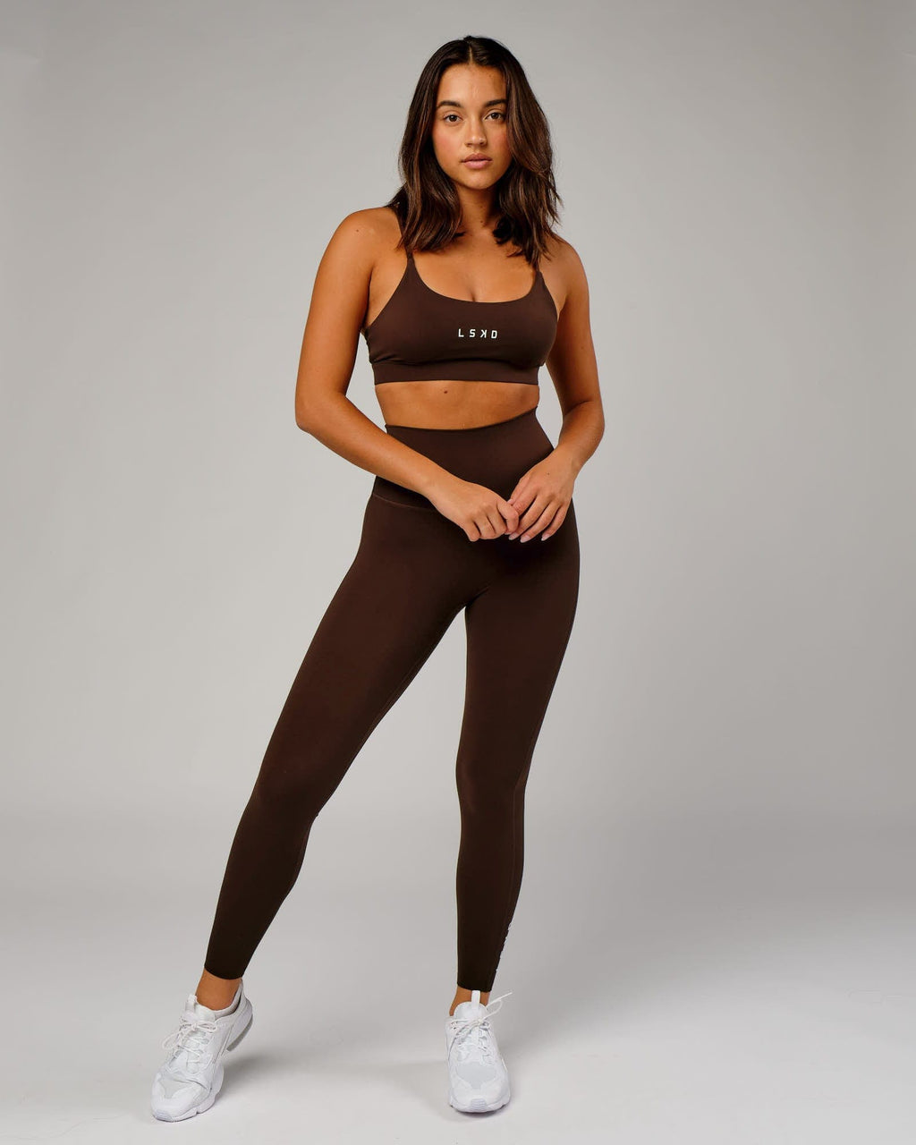 Model wearing Elixir 7/8 Length Tight - Chocolate