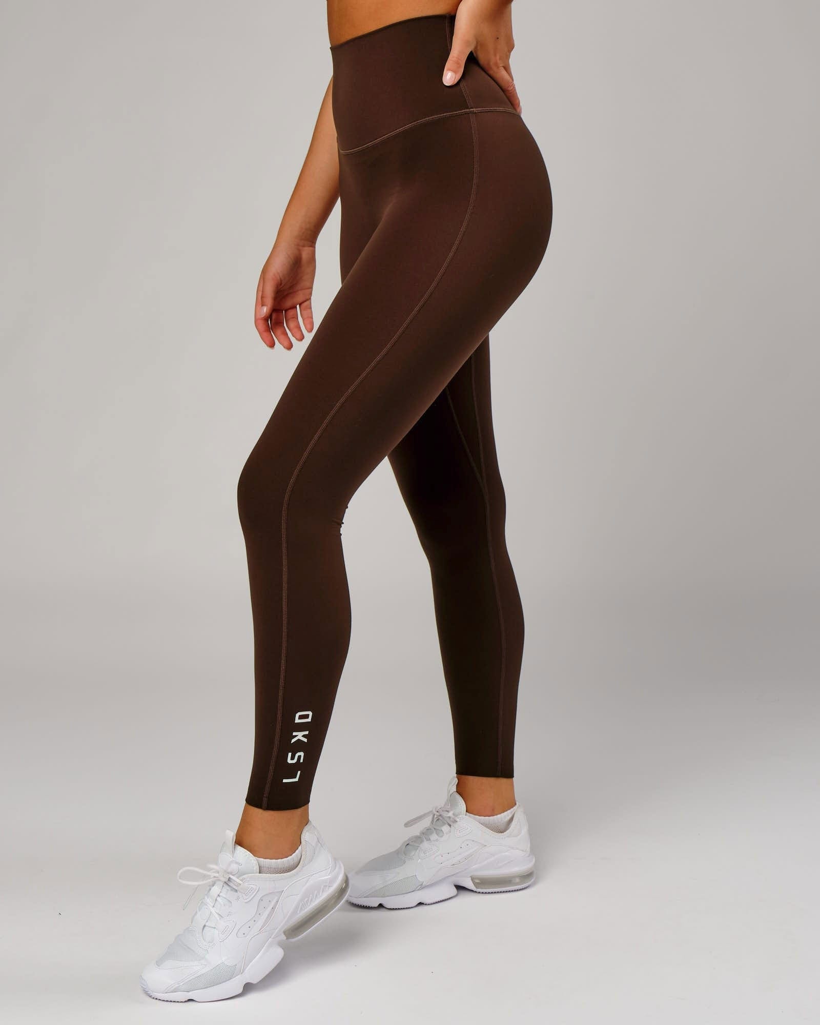 Model wearing Elixir 7/8 Length Tight - Chocolate