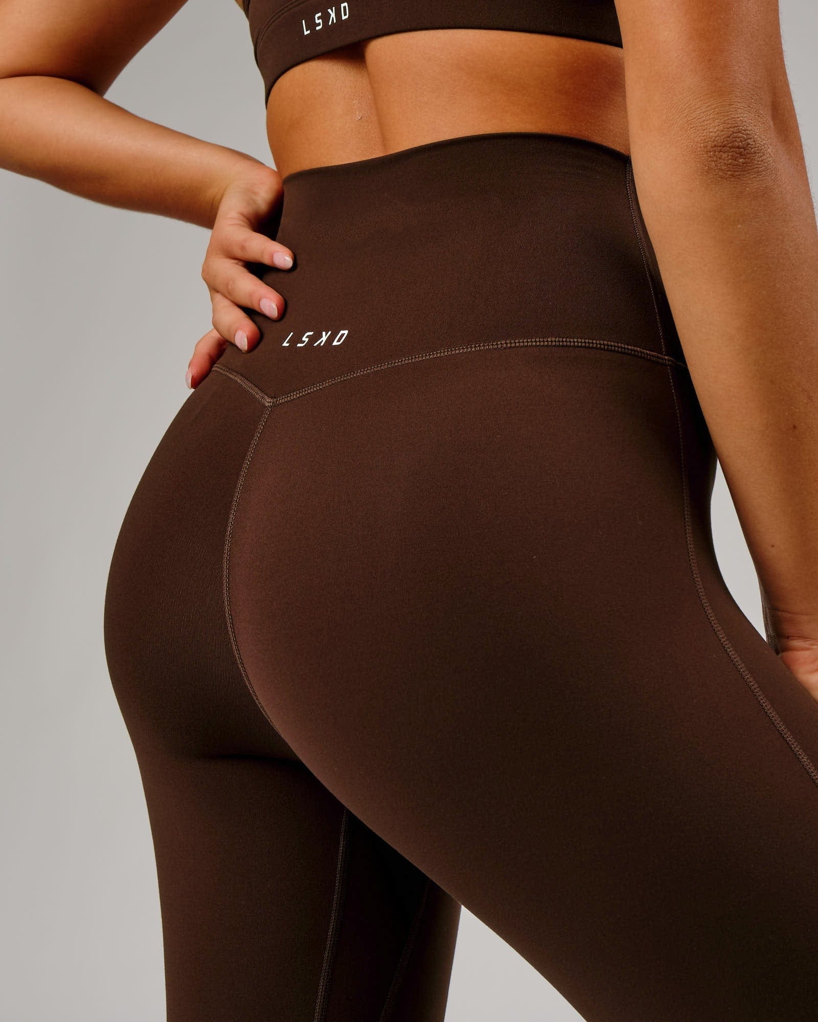 Model wearing Elixir 7/8 Length Tight - Chocolate